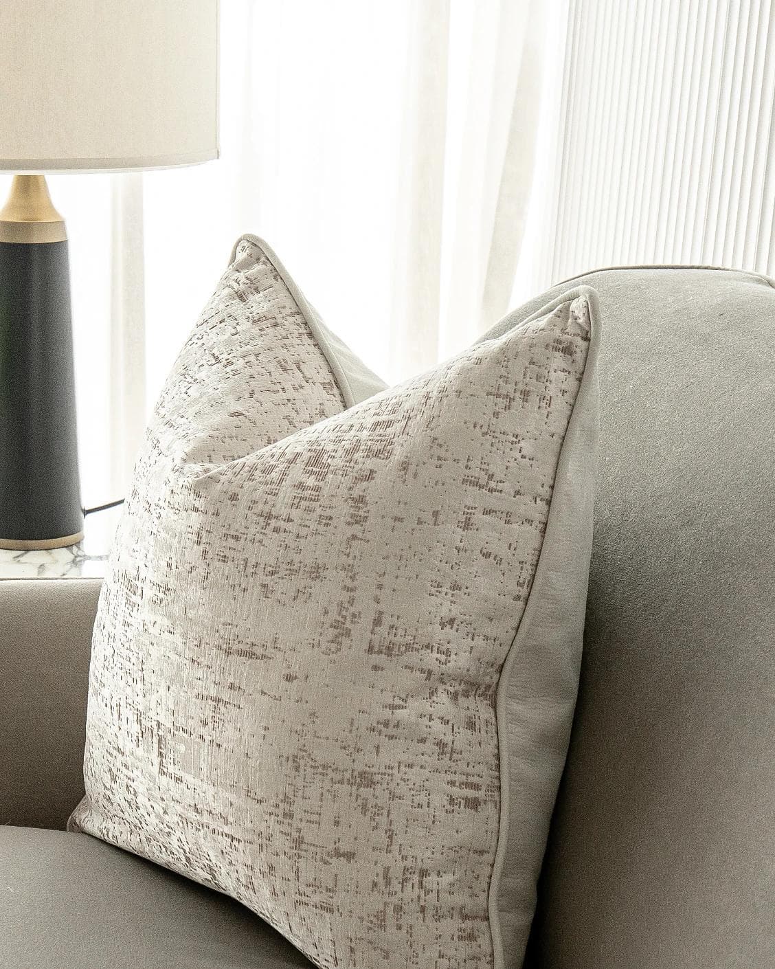 Arlo Bianca cushion in white, shown in a lifestyle right view as image 5