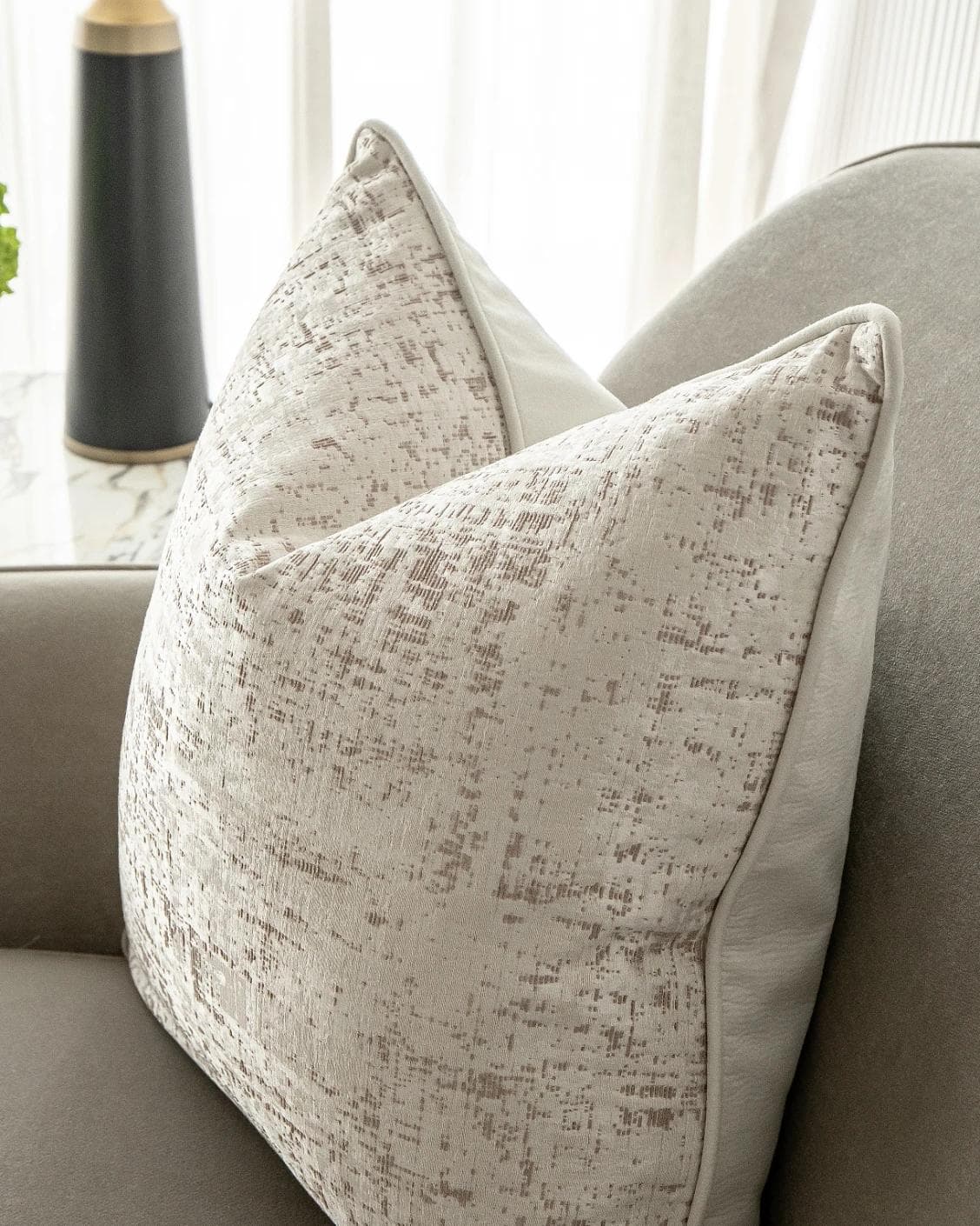 Arlo Bianca cushion in white, shown in a lifestyle right view as image 6