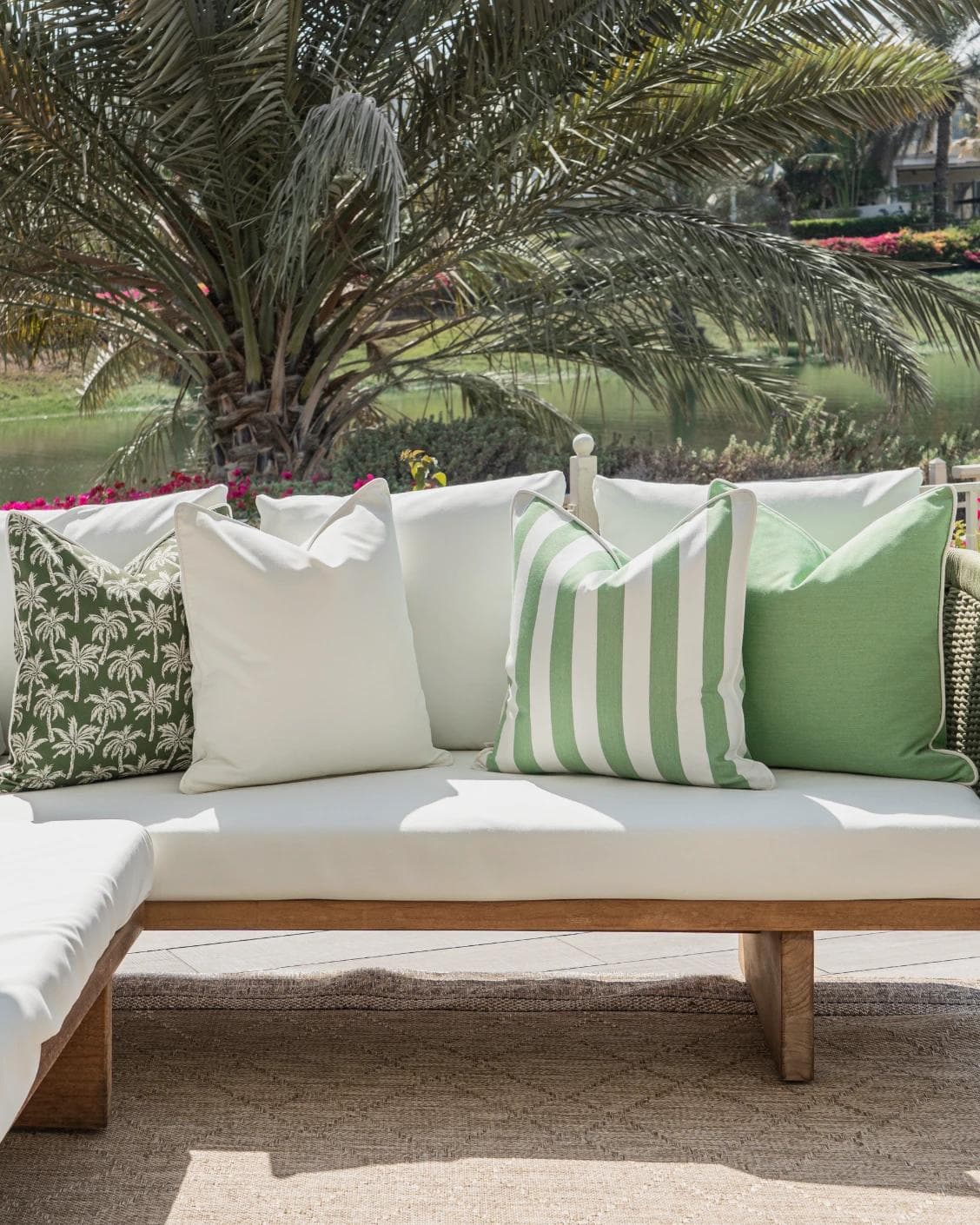 Arsh Bundle cushion in green and ivory, shown in a lifestyle front view as image 4