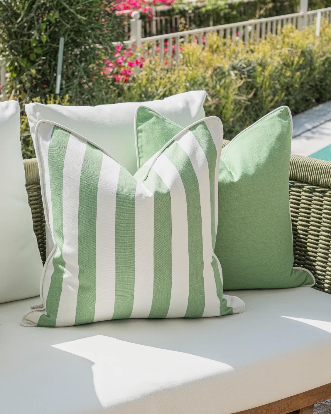 Arsh Bundle cushion in green and ivory, shown in a lifestyle left view as image 5