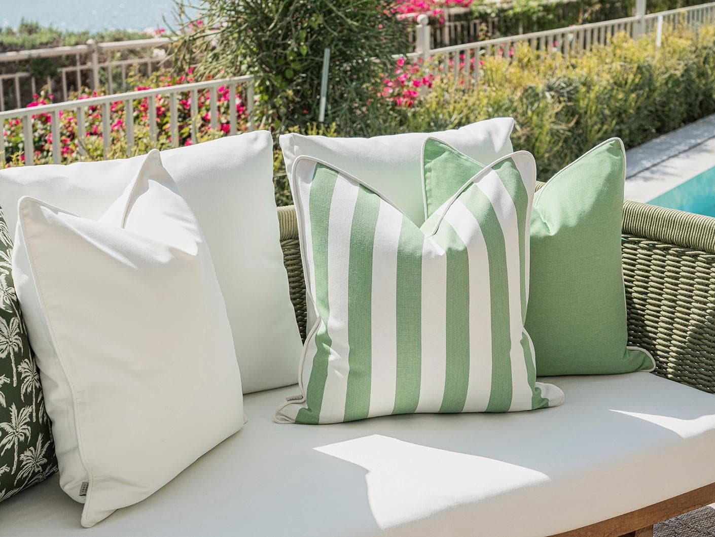 Arsh Bundle cushion in green and ivory, shown in a lifestyle left view as image 5