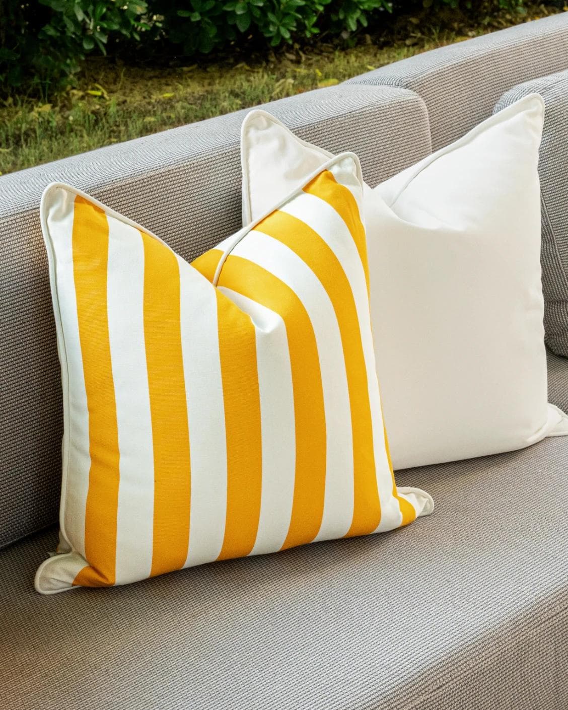 Arun Bundle cushion in yellow, ivory and black, shown in a lifestyle left view as image 5