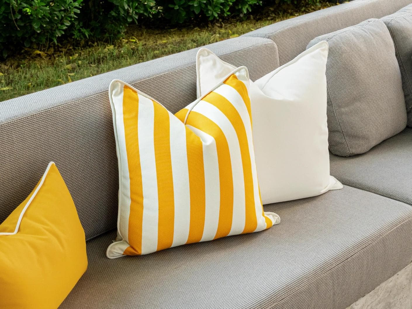 Arun Bundle cushion in yellow, ivory and black, shown in a lifestyle left view as image 5