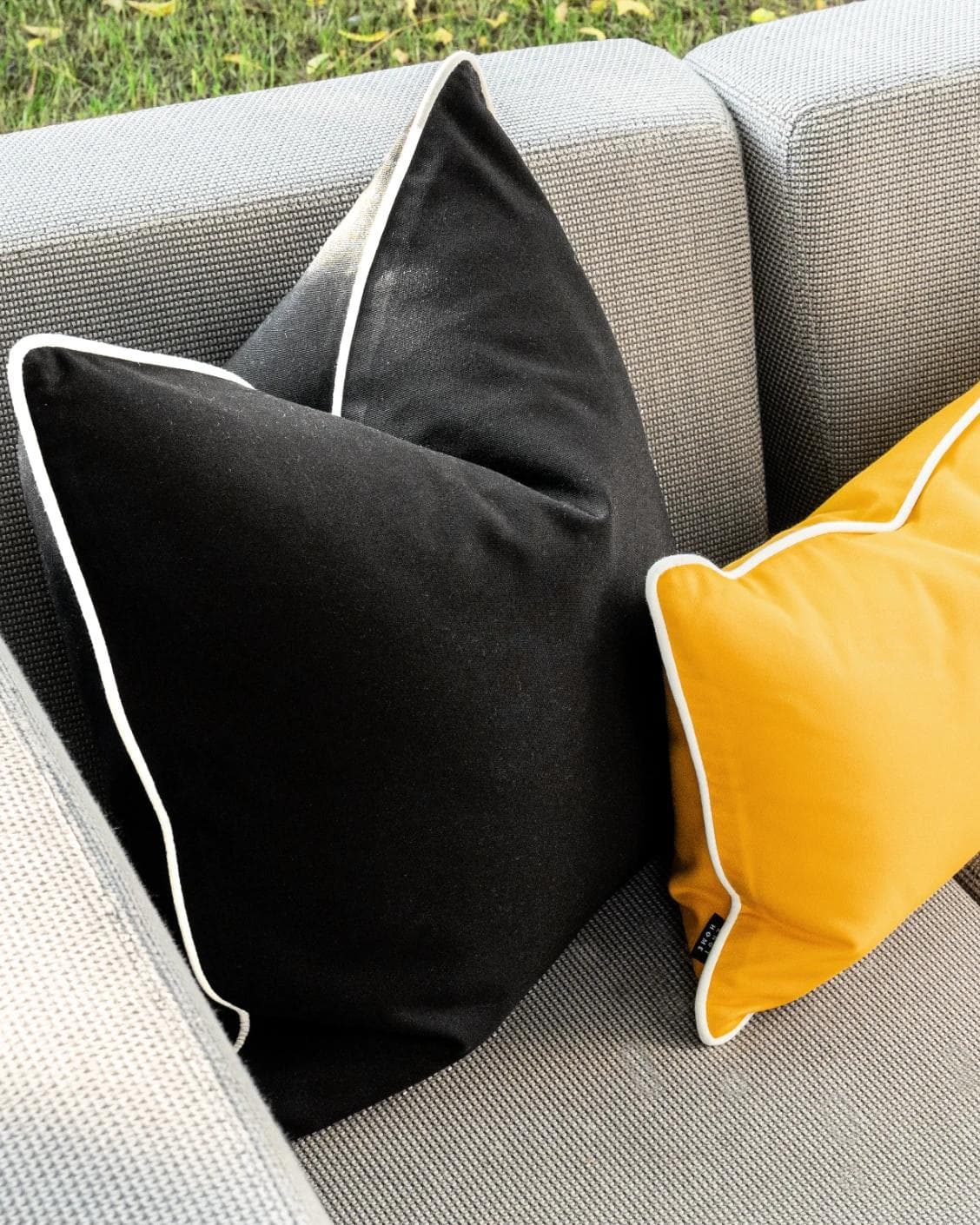 Arun Bundle cushion in yellow, ivory and black, shown in a lifestyle left view as image 6