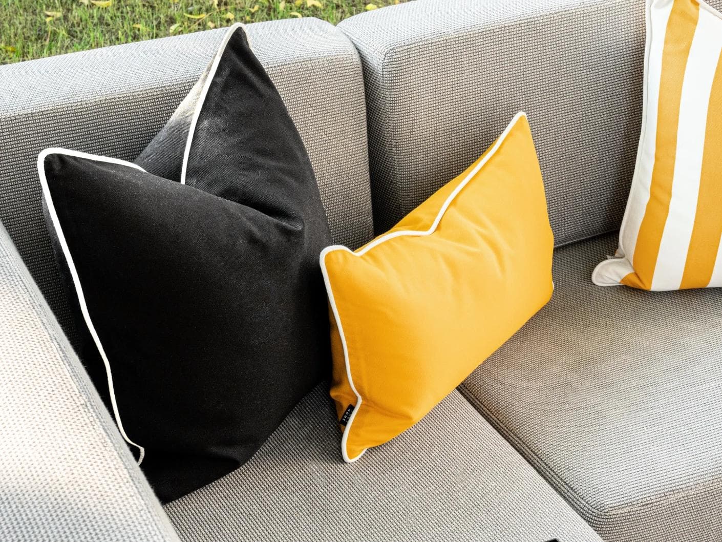 Arun Bundle cushion in yellow, ivory and black, shown in a lifestyle left view as image 6