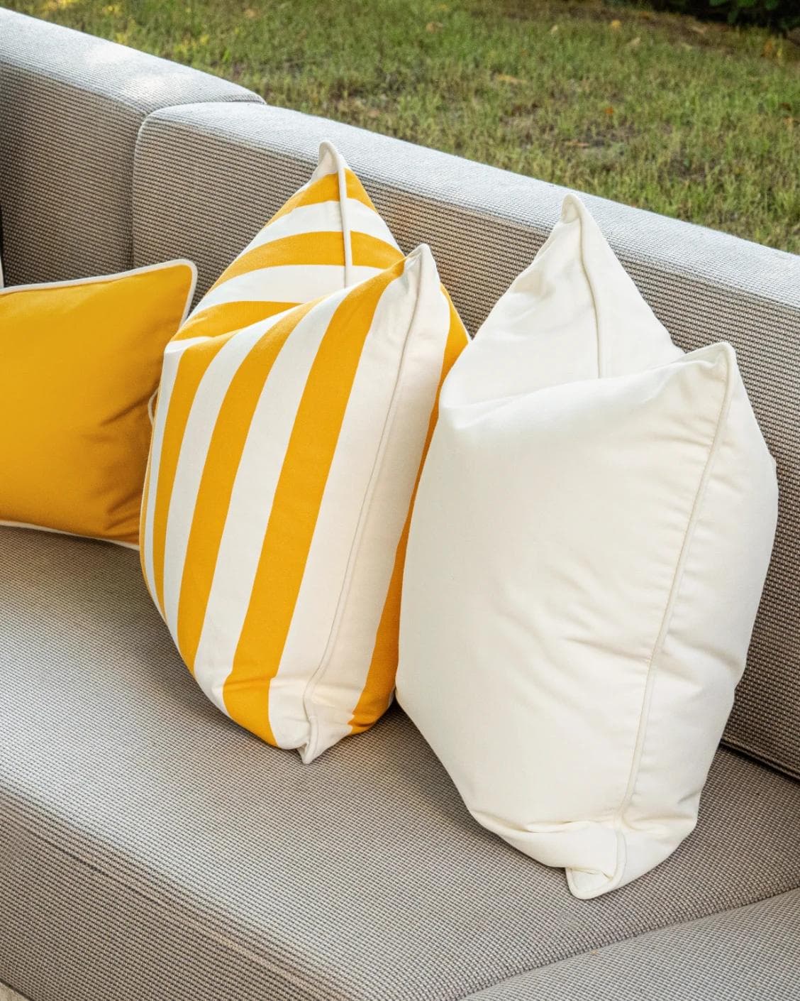 Arun Bundle cushion in yellow, ivory and black, shown in a lifestyle right view as image 7