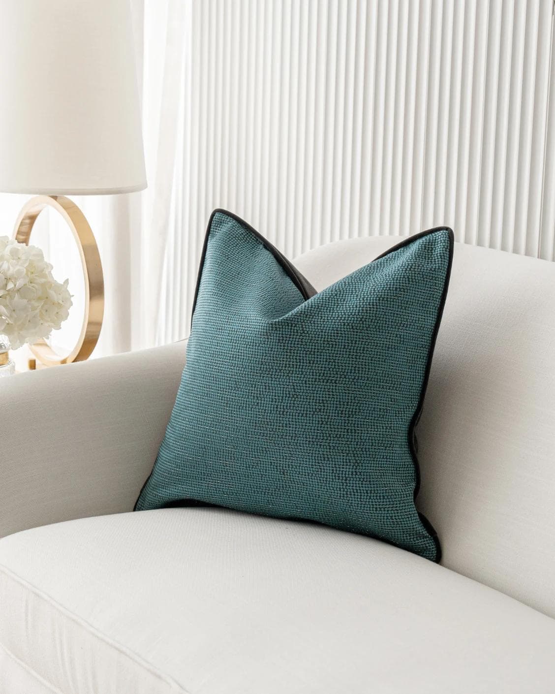 Asta Canova cushion in blue, shown in a lifestyle right view as image 2