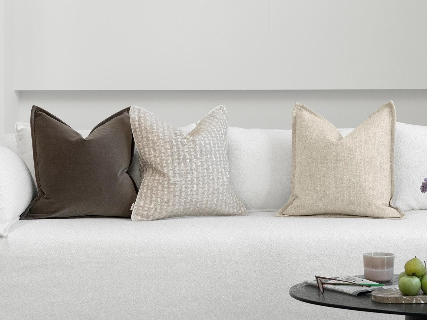 Astle Bundle cushion in ivory, beige and brown, shown in a lifestyle front view as image 4
