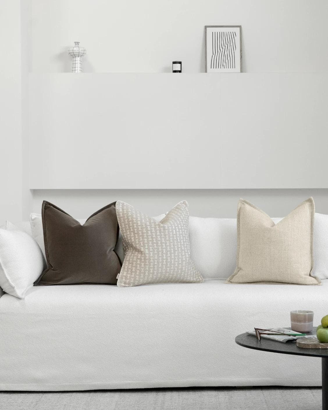 Astle Bundle cushion in ivory, beige and brown, shown in a lifestyle front view as image 4