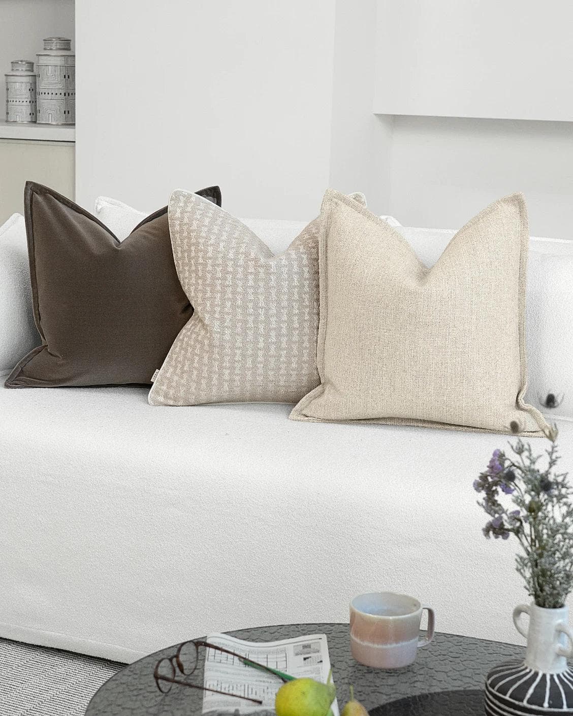 Astle Bundle cushion in ivory, beige and brown, shown in a lifestyle right view as image 2