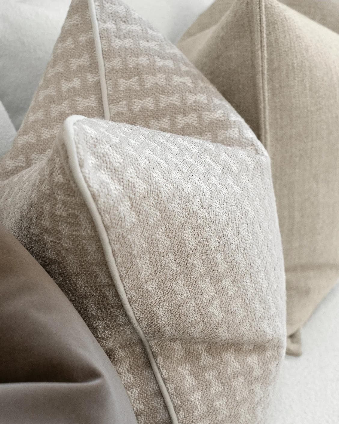 Astle Bundle cushion in ivory, beige and brown, shown in a product close-up left view as image 5