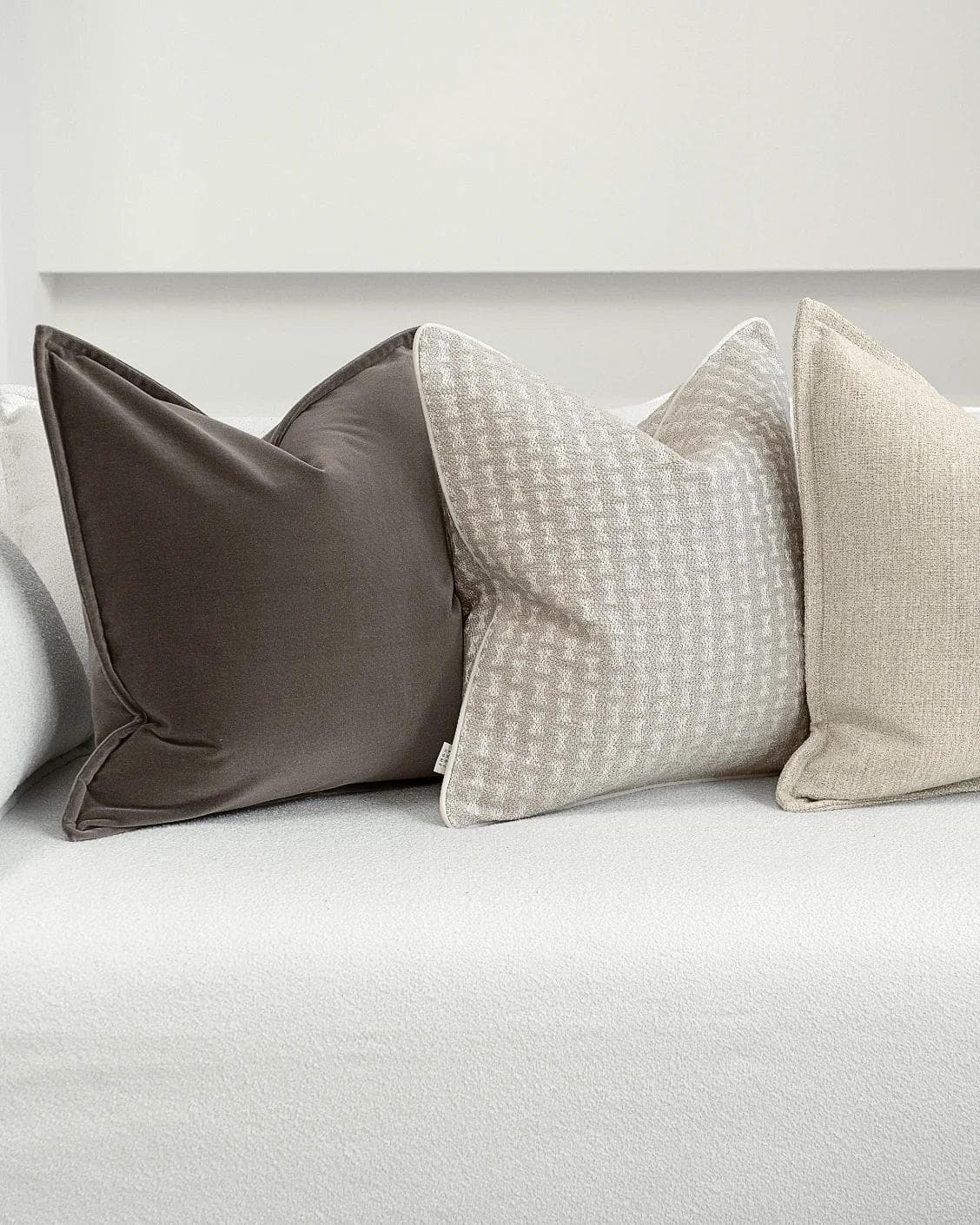 Astle Bundle cushion in ivory, beige and brown, shown in a product left view as image 6