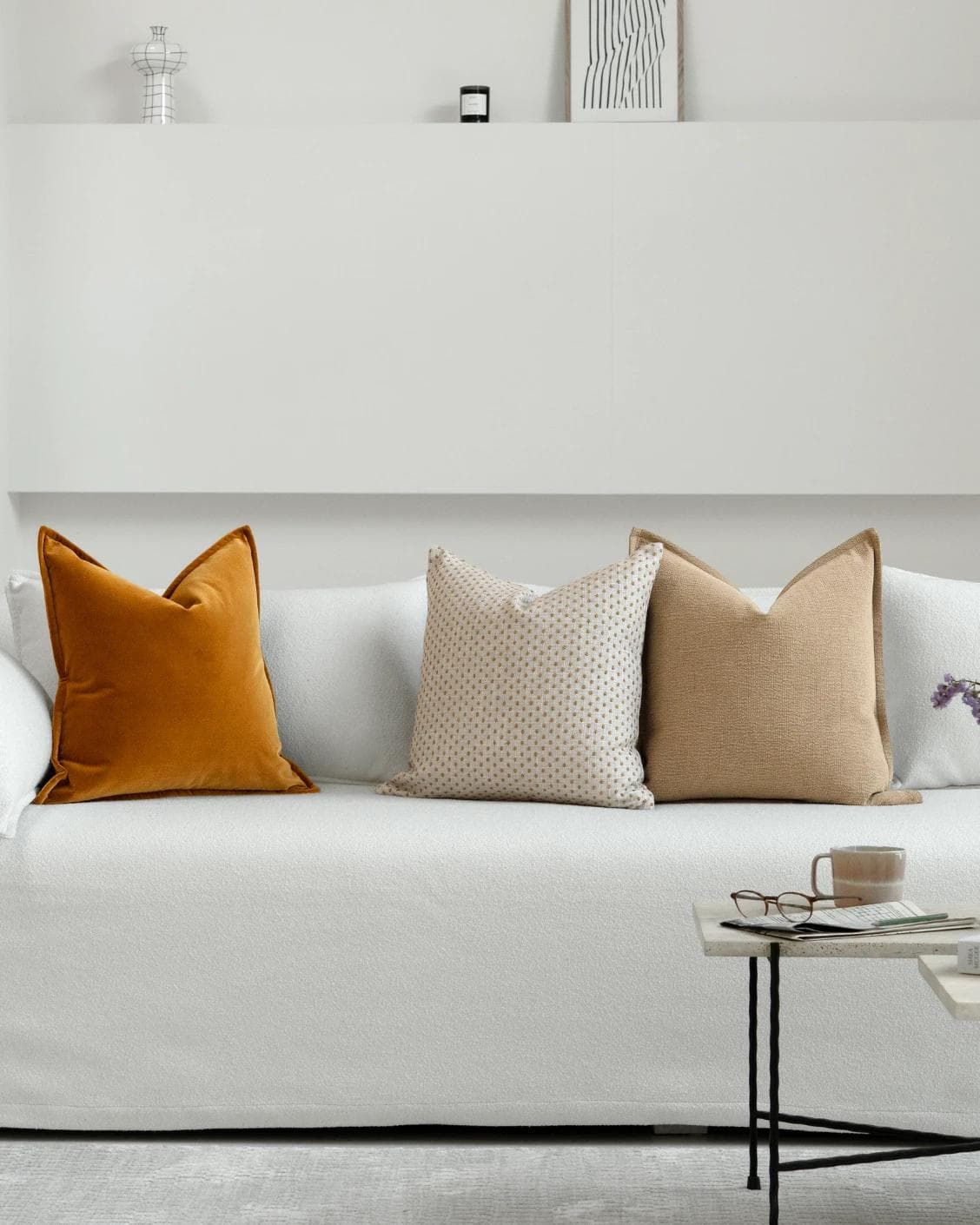 Astra Bundle cushion in beige, brown and orange, shown in a lifestyle front view as image 4