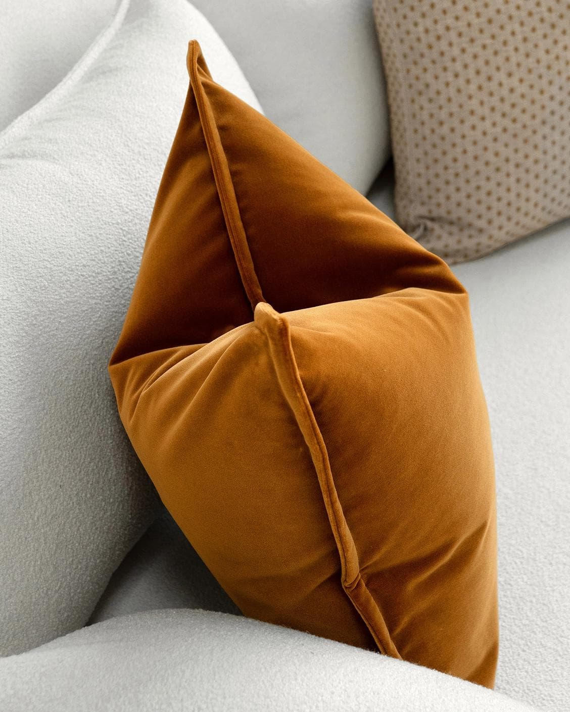 Astra Bundle cushion in beige, brown and orange, shown in a lifestyle left view as image 6