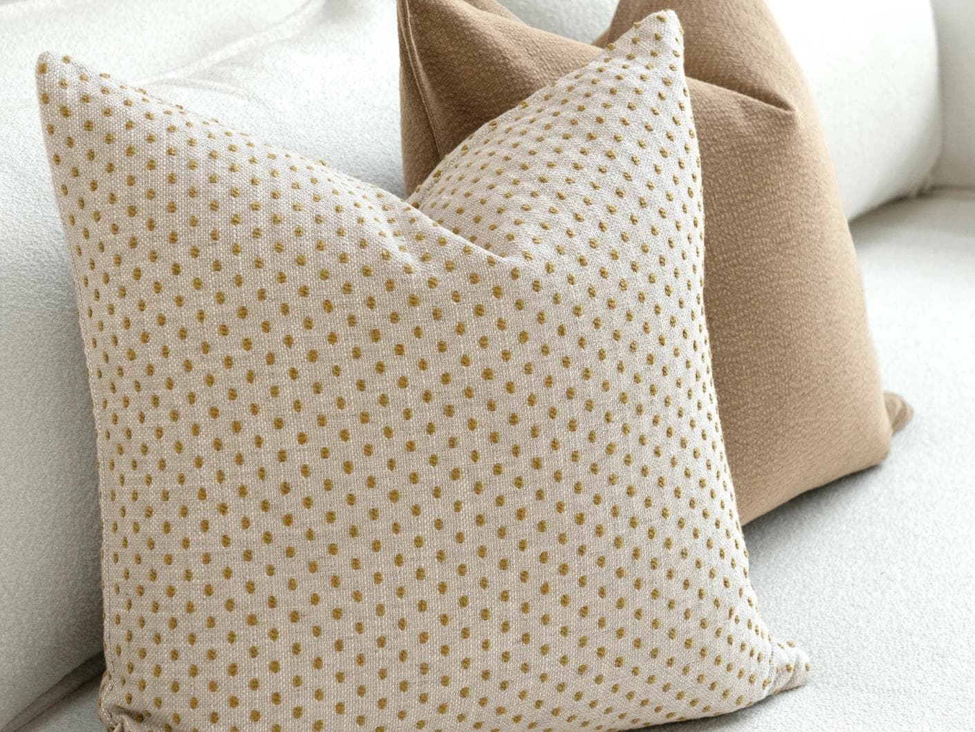 Astra Bundle cushion in beige, brown and orange, shown in a lifestyle left view as image 7