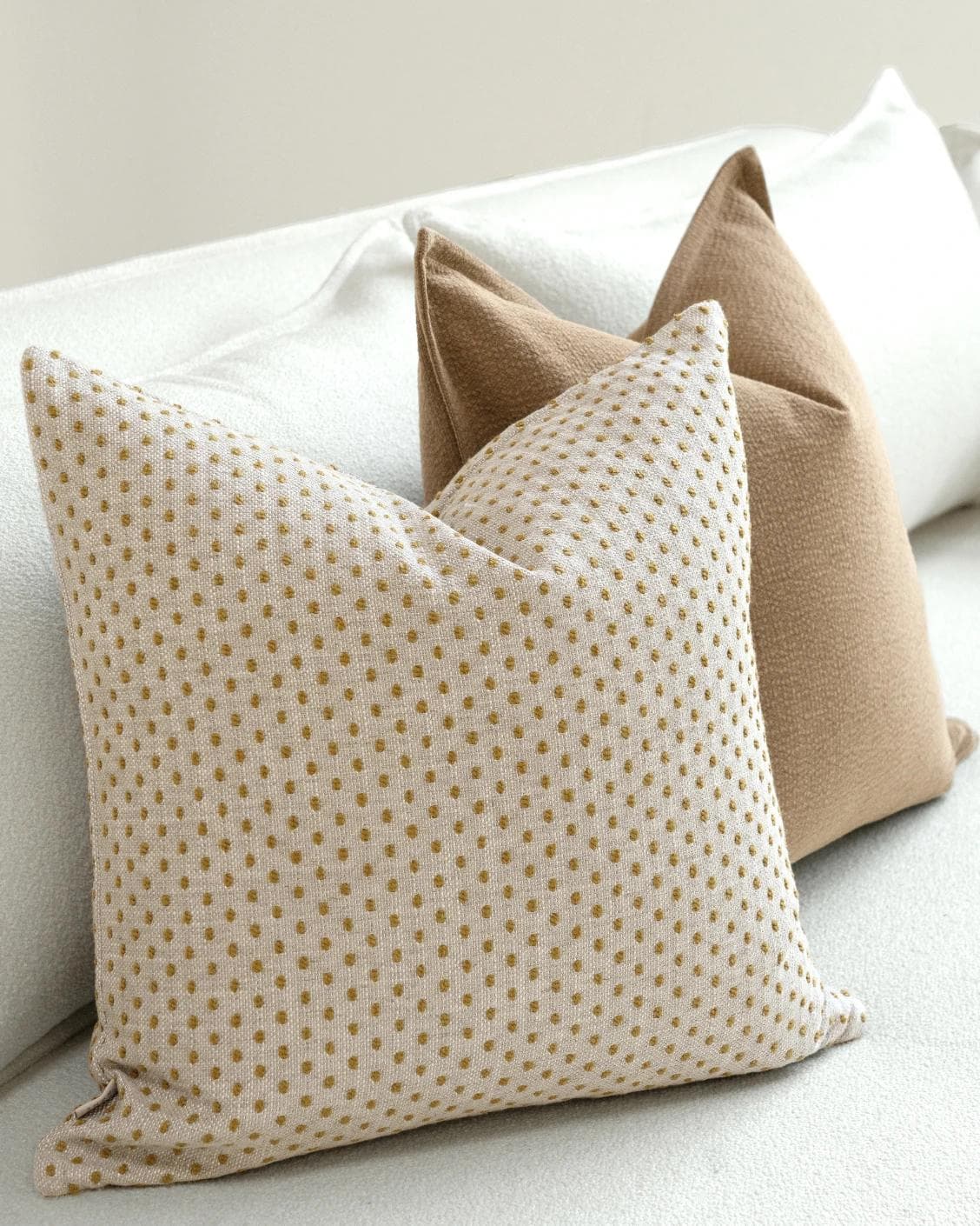 Astra Bundle cushion in beige, brown and orange, shown in a lifestyle left view as image 7