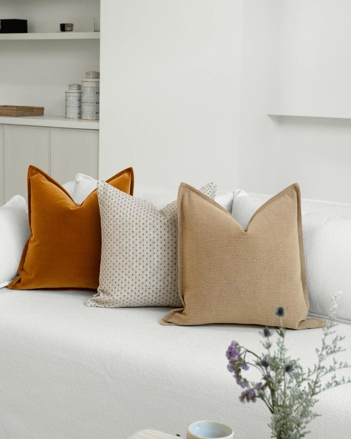 Astra Bundle cushion in beige, brown and orange, shown in a lifestyle right view as image 2