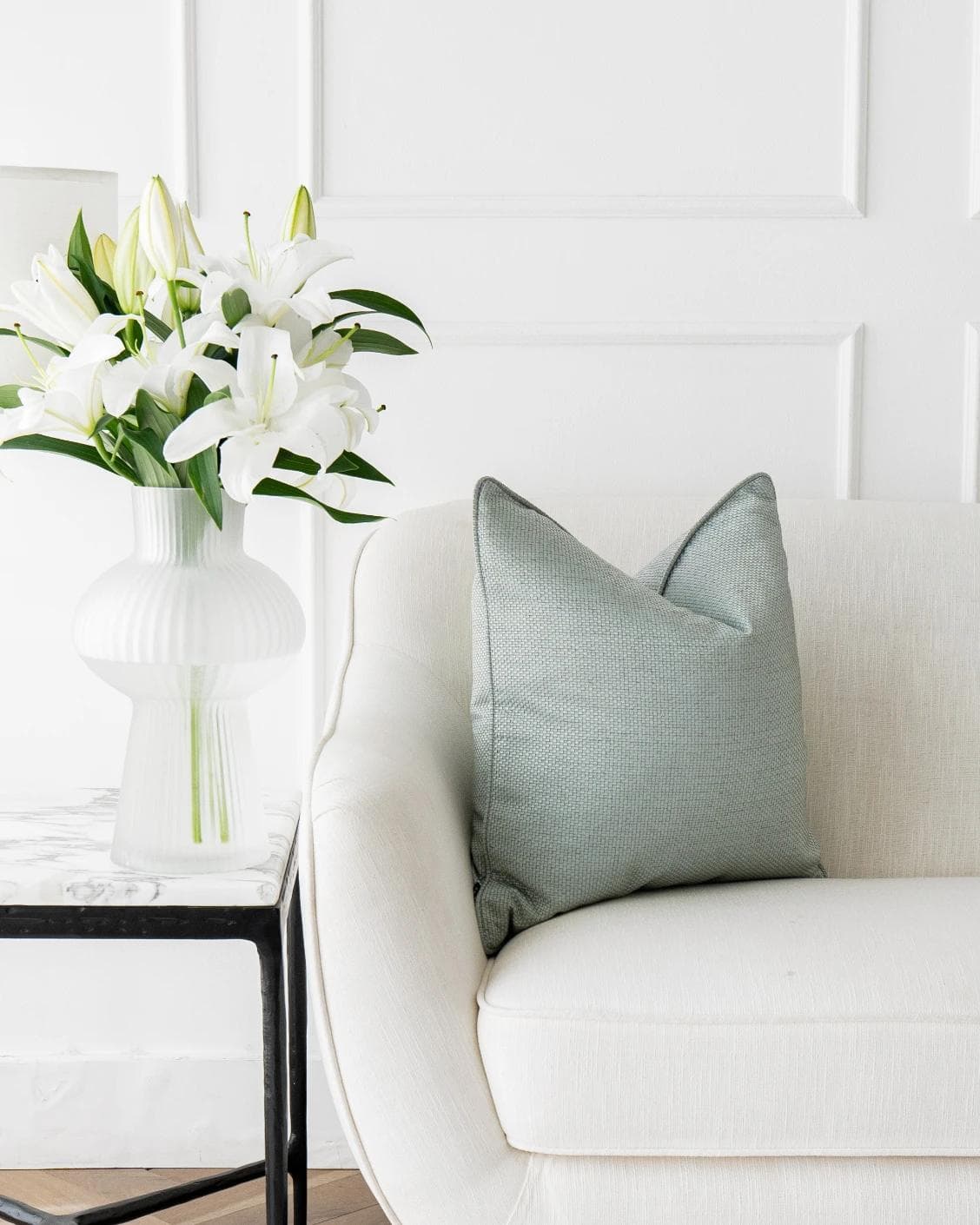 Astrid Sage cushion in green, shown in a lifestyle front view as image 4