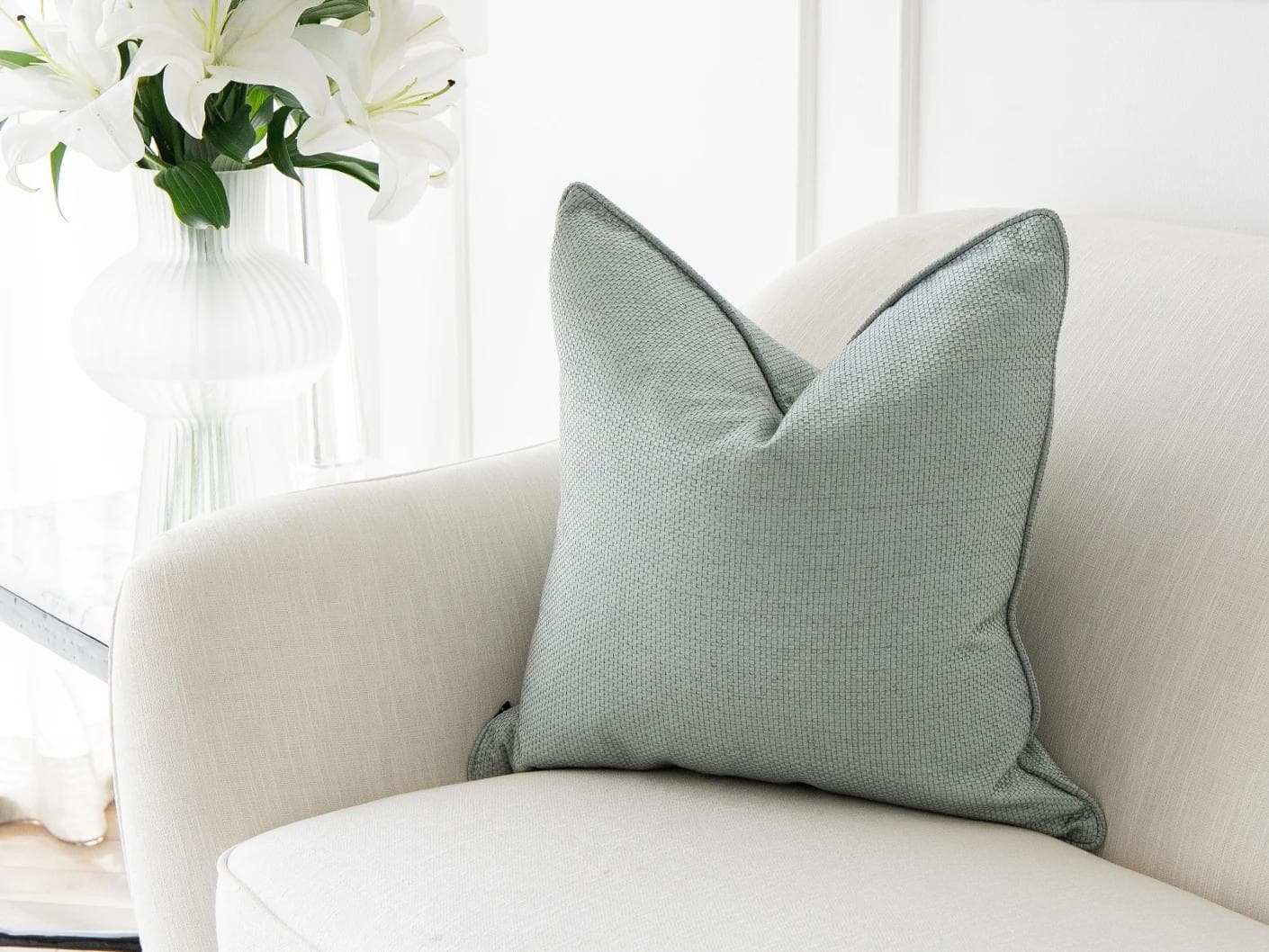 Astrid Sage cushion in green, shown in a lifestyle right view as image 2