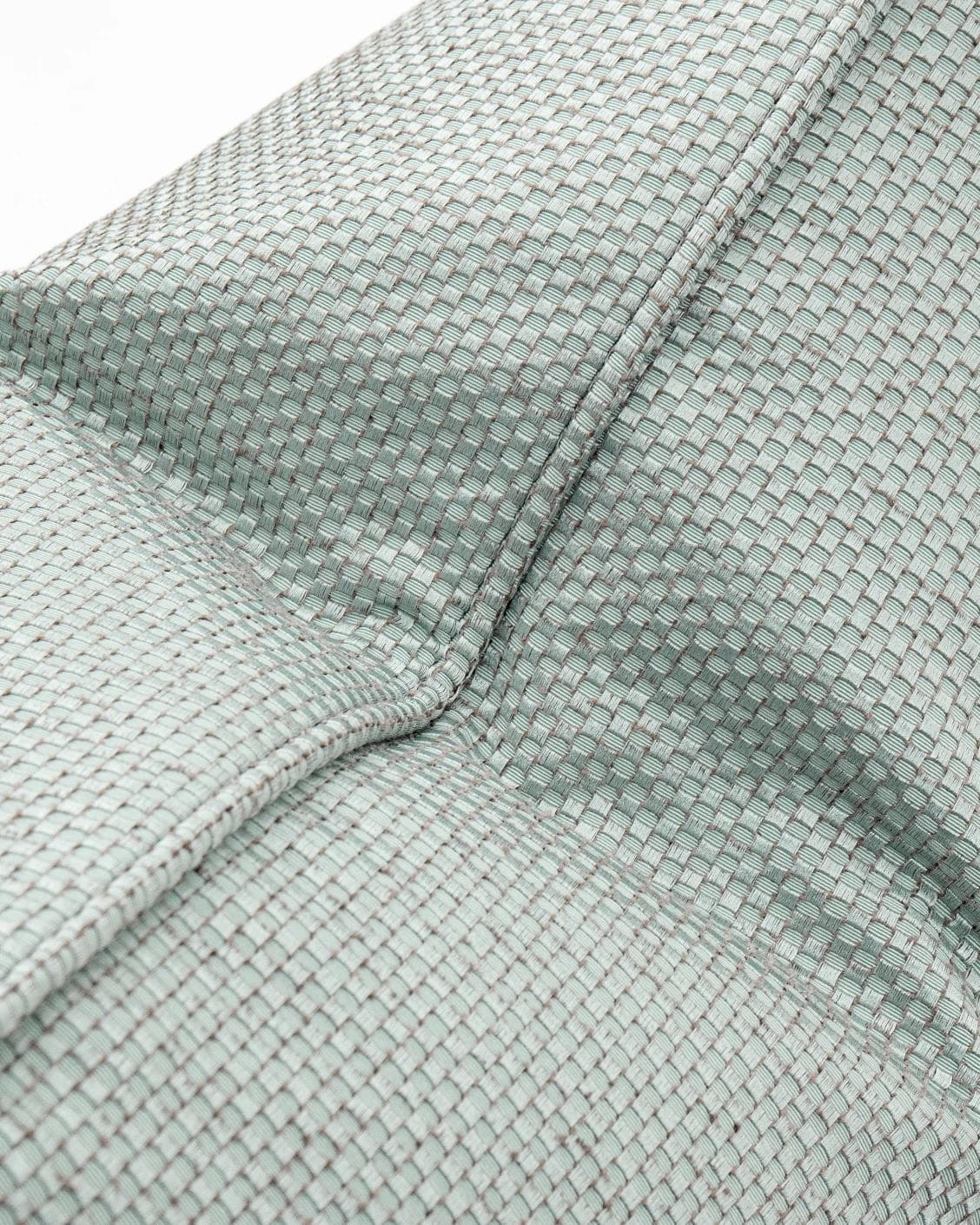 Astrid Sage cushion in green, shown in a product close-up as image 5