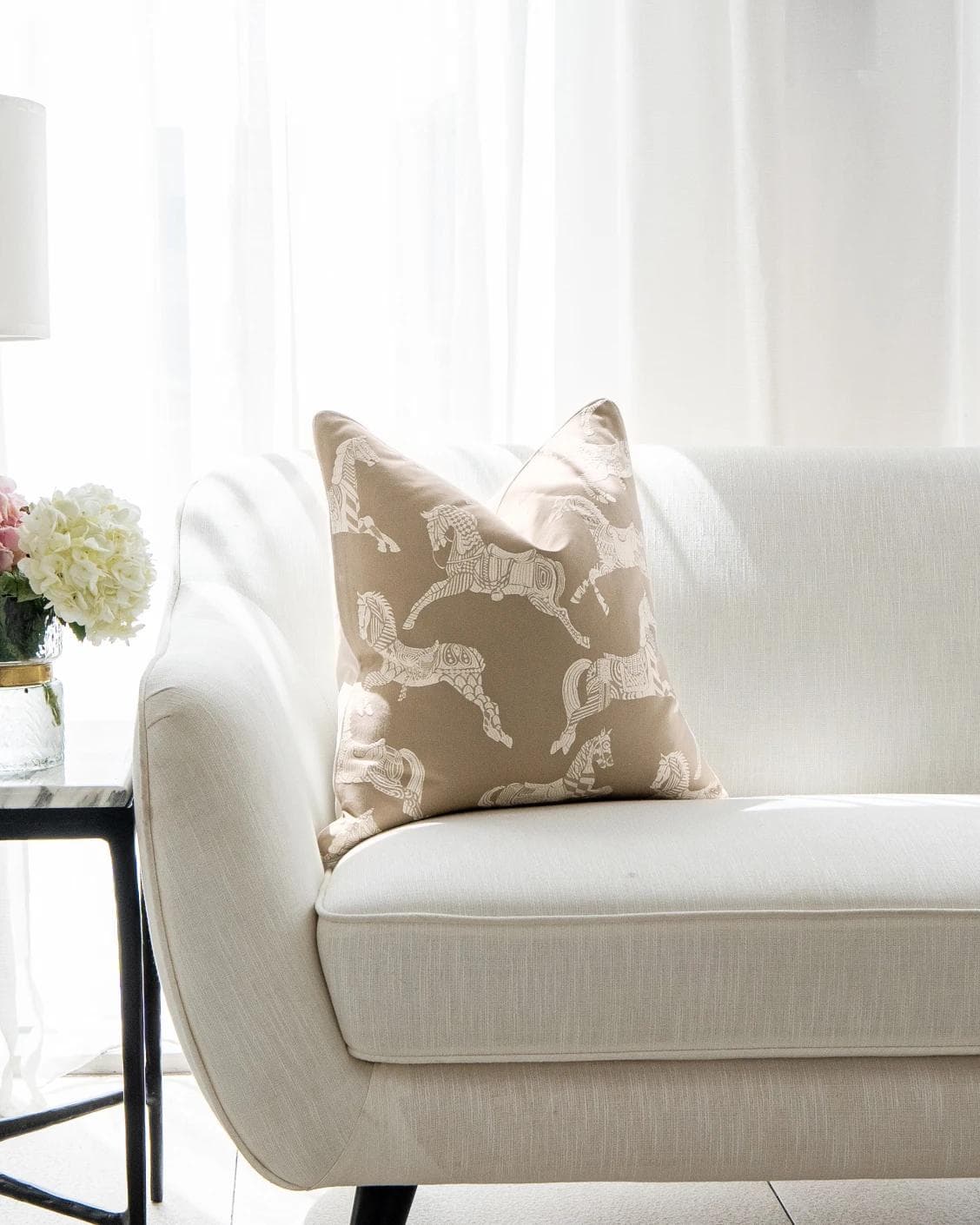 Aurora Hodler cushion in beige, shown in a lifestyle front view as image 4