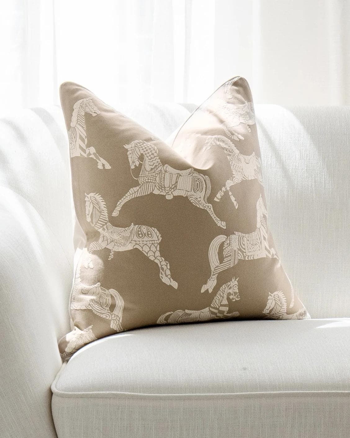 Aurora Hodler cushion in beige, shown in a lifestyle front view as image 5