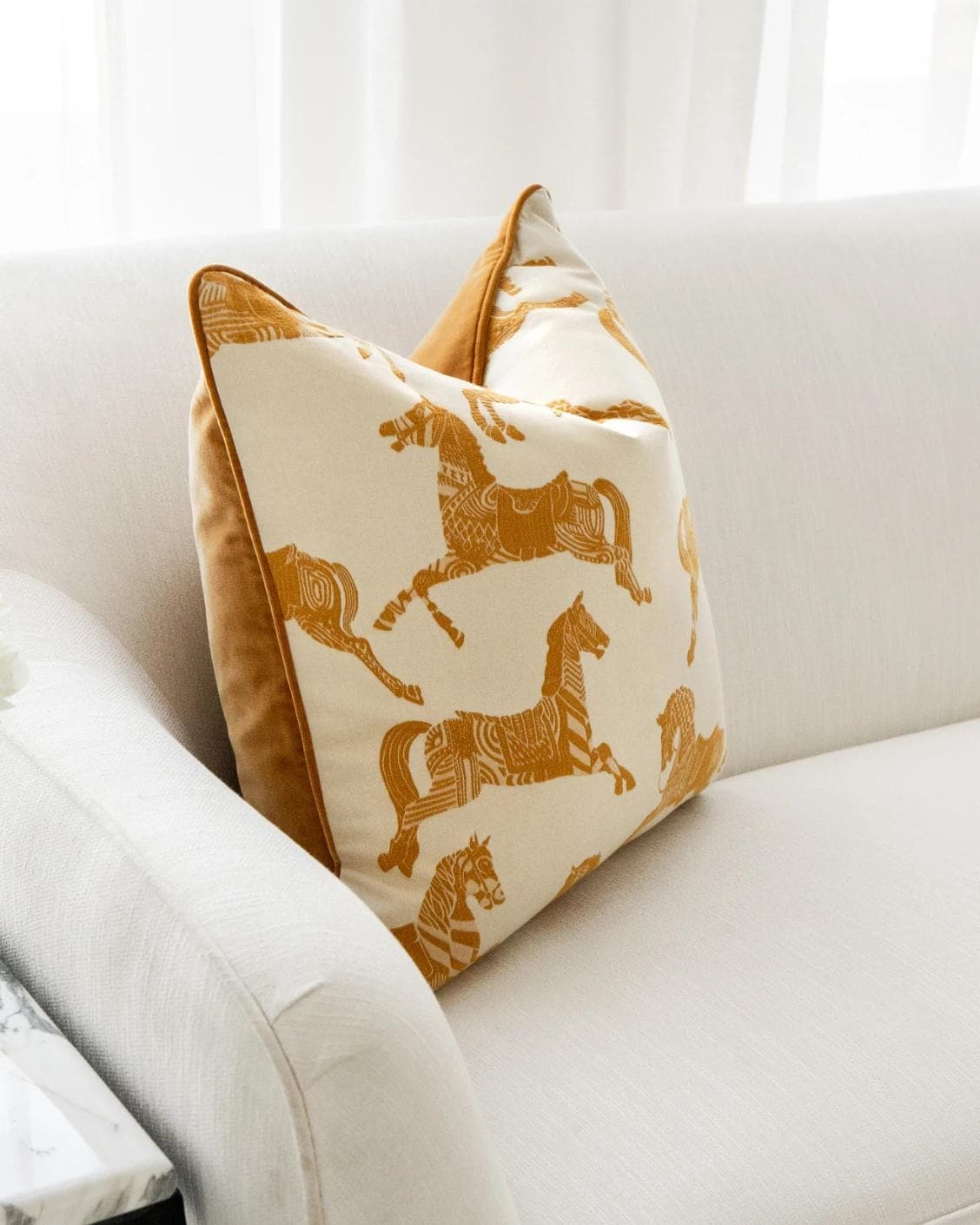 Aurora Klimt cushion in orange and beige, shown in a lifestyle left view as image 5