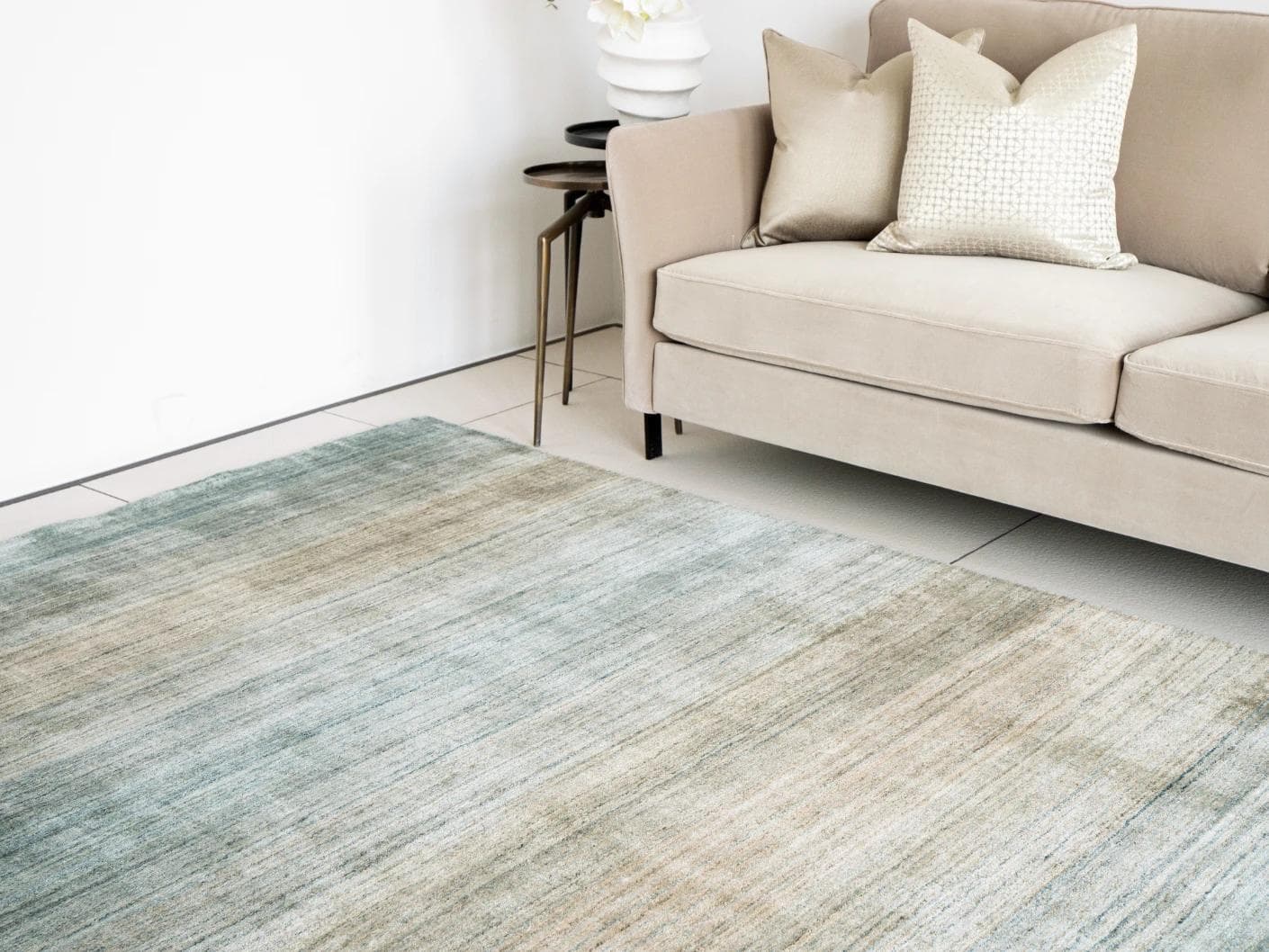 Ava Sandy carpets in turquoise and beige, shown in a lifestyle right view as image 1