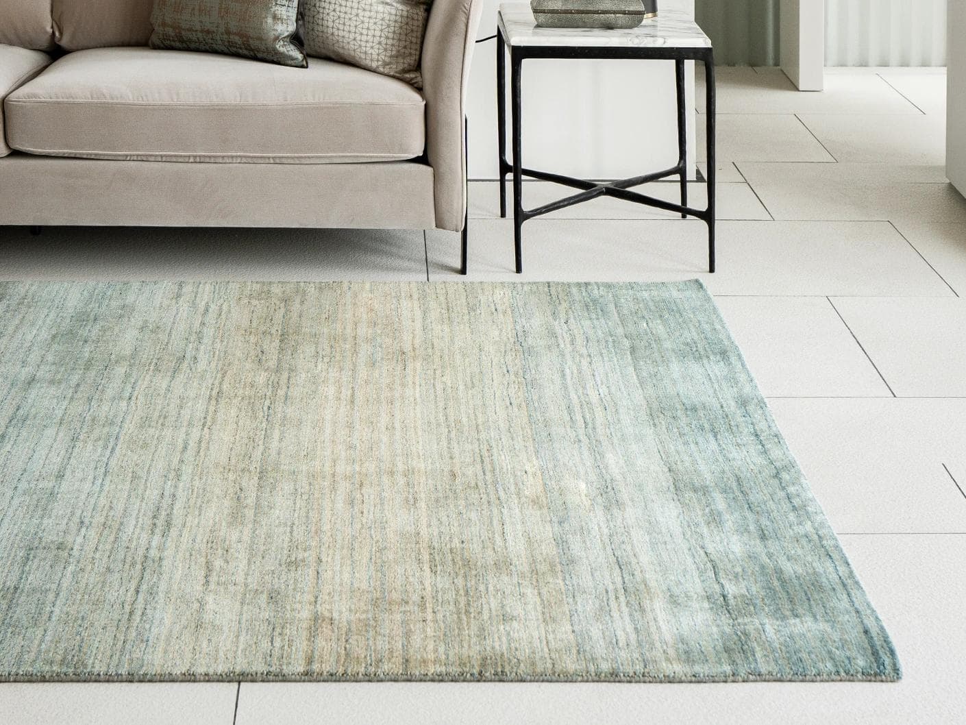 Ava Sandy carpets in turquoise and beige, shown in a lifestyle right view as image 2