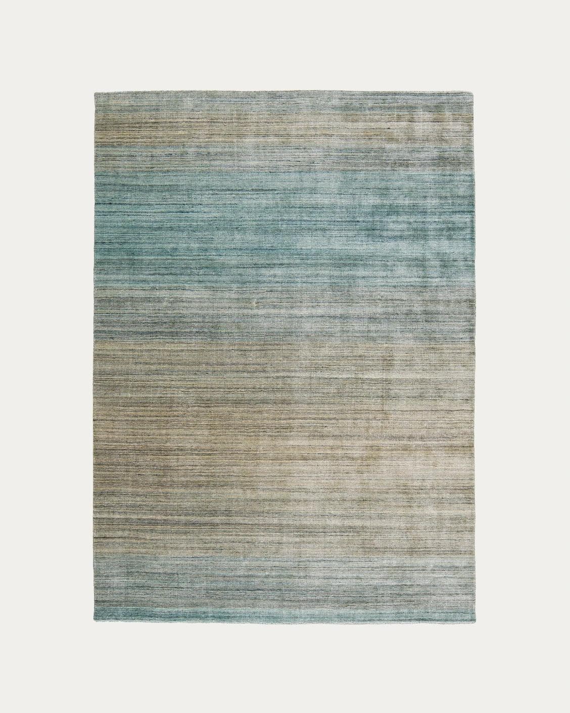 Ava Sandy carpets in turquoise and beige, shown in a product top view as image 1