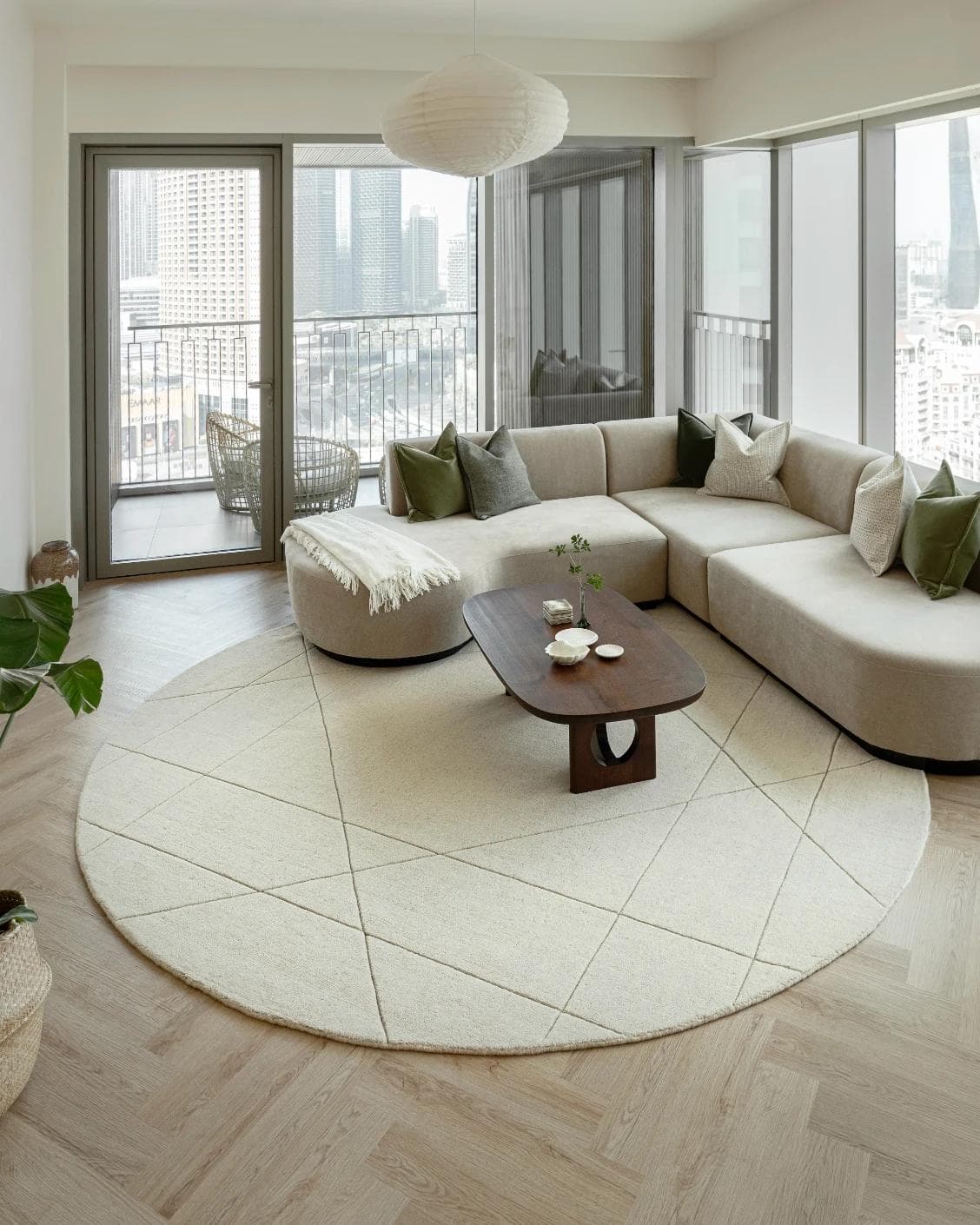 Axis Bianca Round carpet in beige, shown in a lifestyle front view