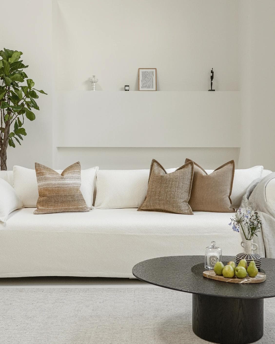 Aya Bundle cushion in brown, shown in a lifestyle front view as image 4