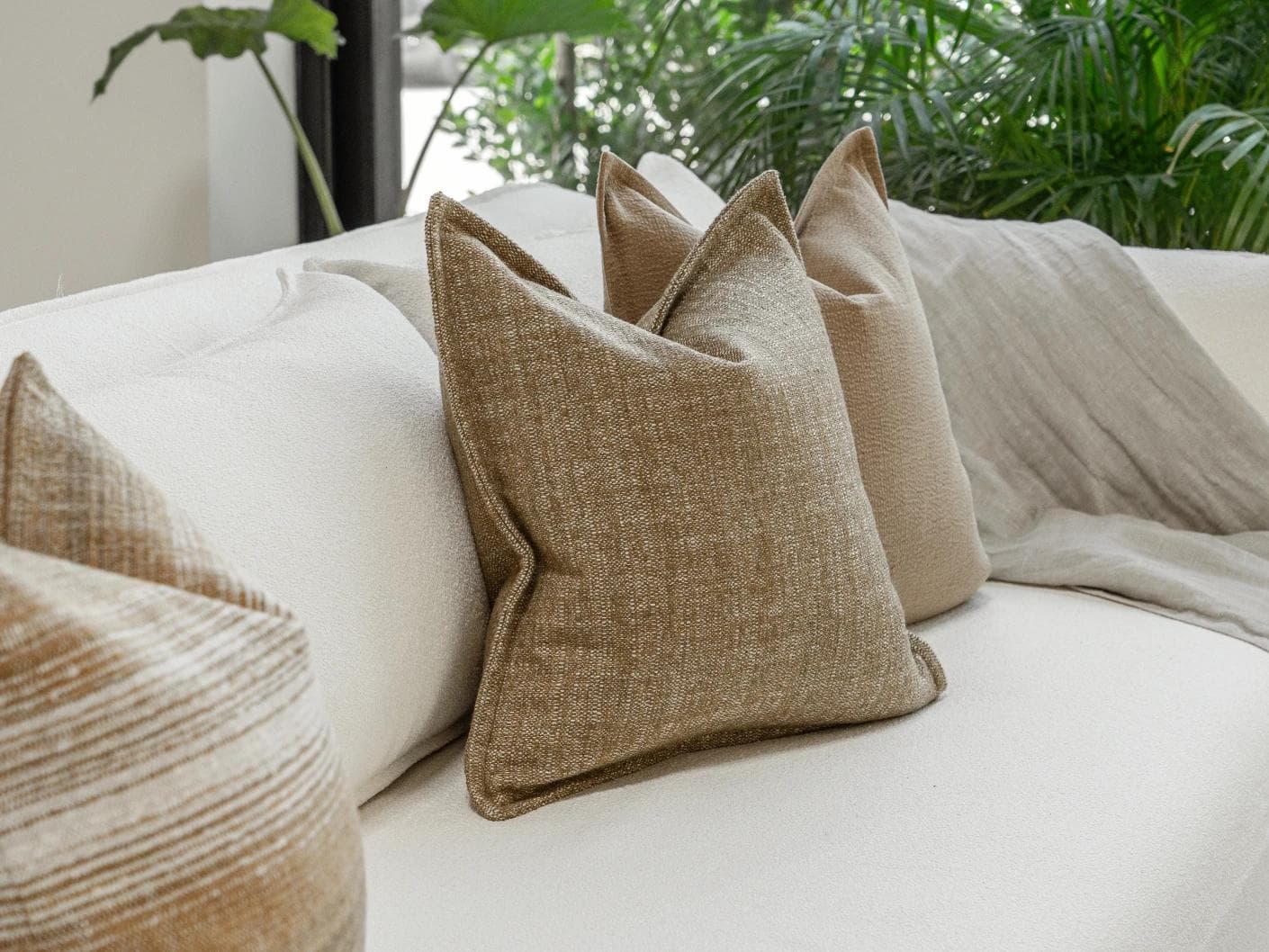 Aya Bundle cushion in brown, shown in a lifestyle left view as image 5