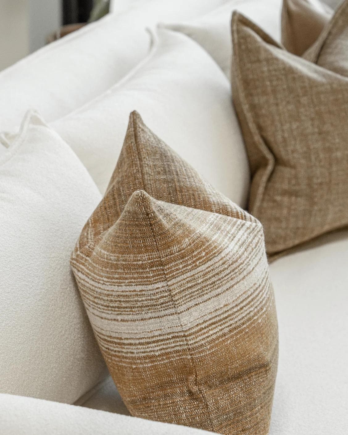 Aya Bundle cushion in brown, shown in a lifestyle left view as image 6