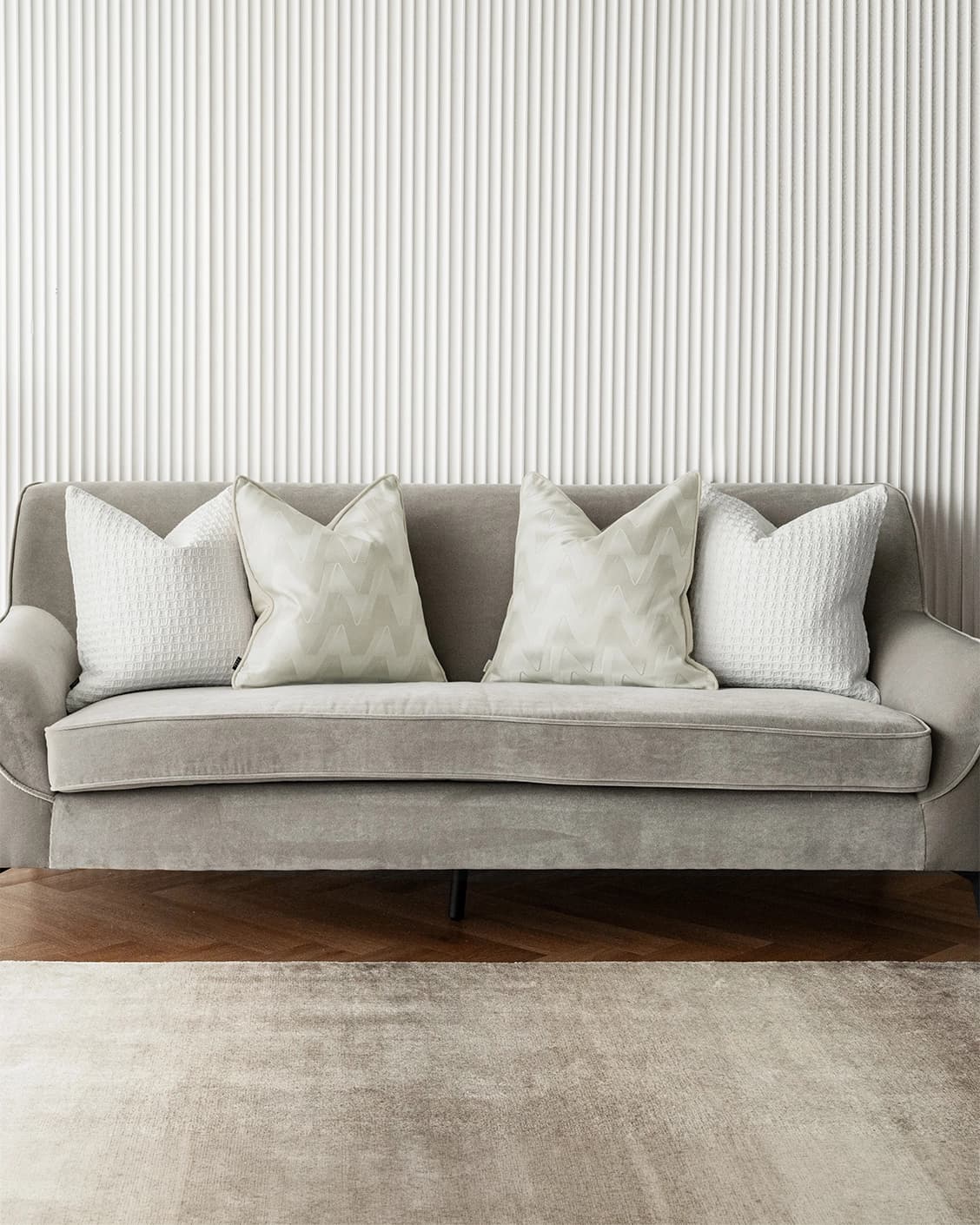 Aynura Bundle cushion in white, beige and silver, shown in a lifestyle front view as image 5
