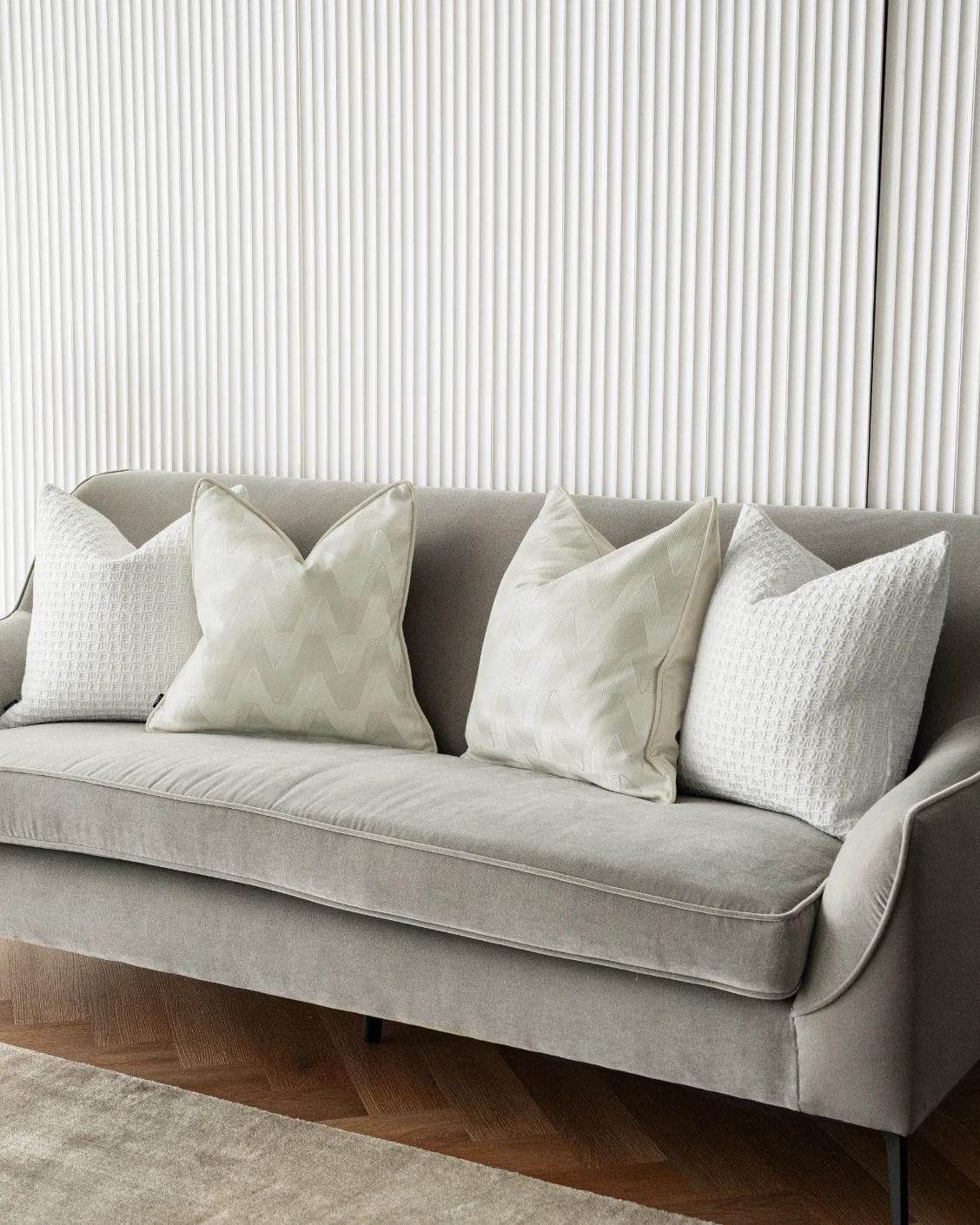 Aynura Bundle cushion in white, beige and silver, shown in a lifestyle right view as image 2