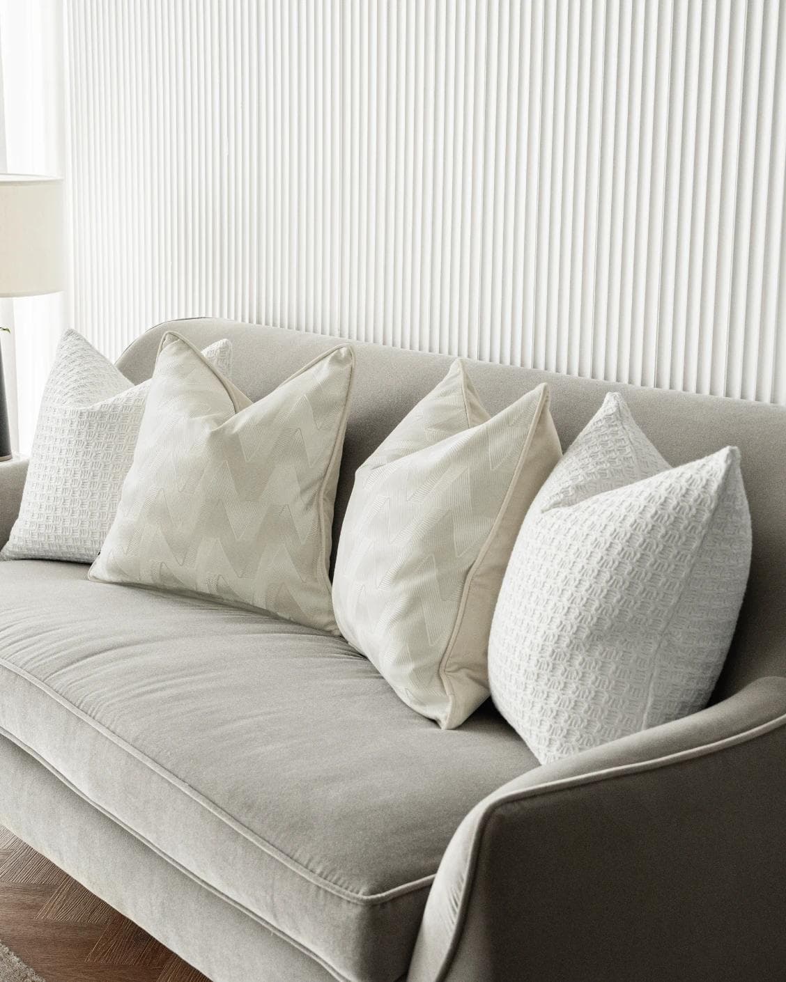 Aynura Bundle cushion in white, beige and silver, shown in a lifestyle right view as image 6