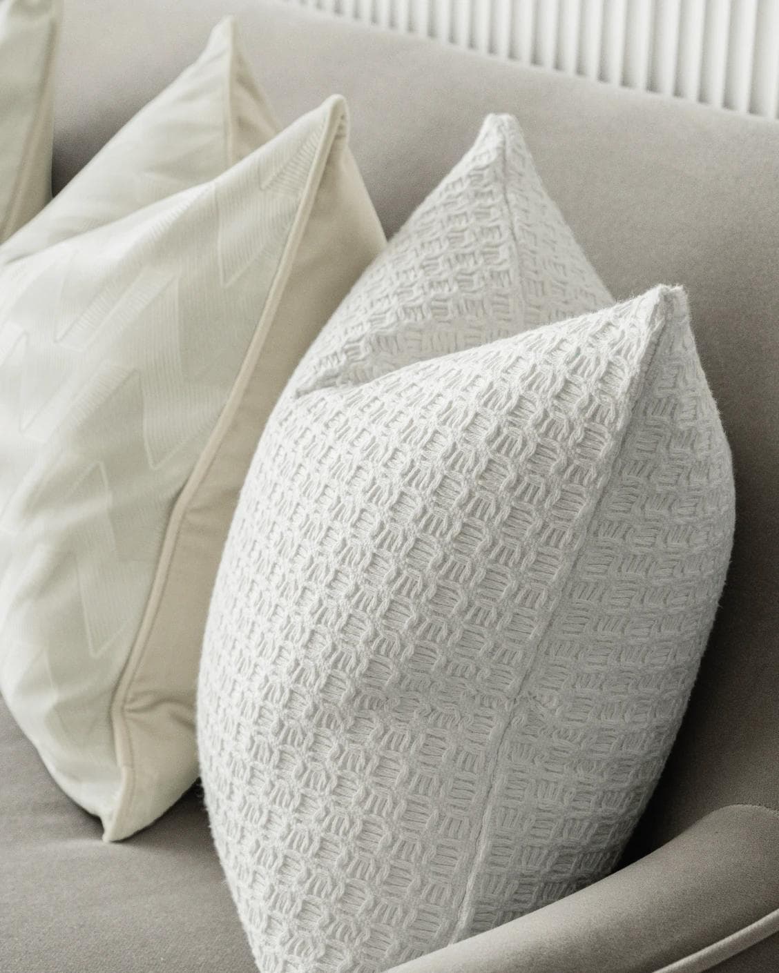 Aynura Bundle cushion in white, beige and silver, shown in a lifestyle right view as image 7