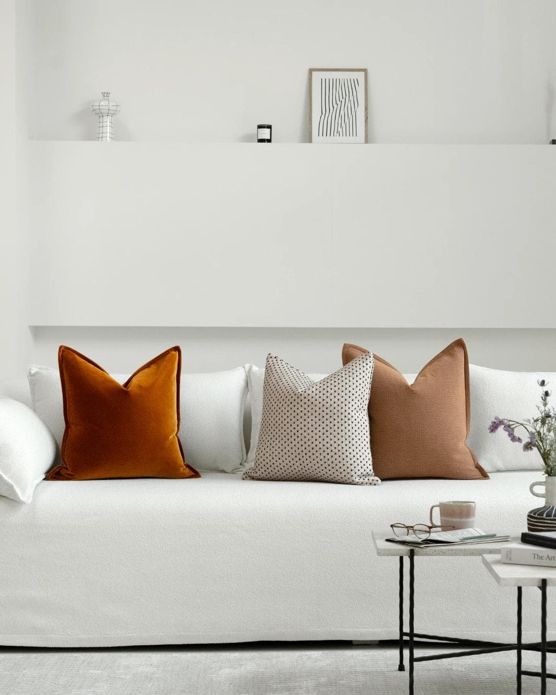 Azar Bundle cushion in beige and rust, shown in a lifestyle front view as image 4