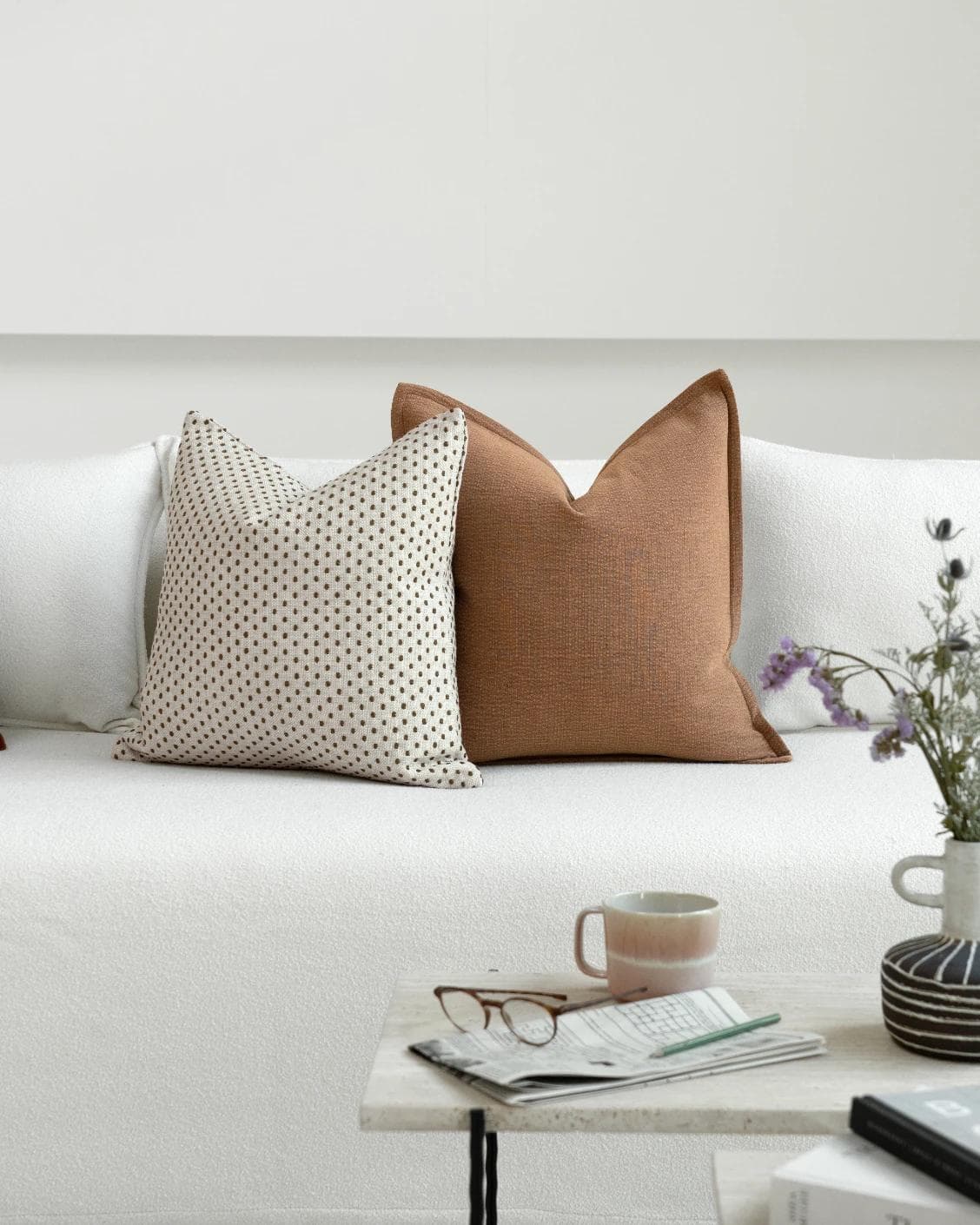 Azar Bundle cushion in beige and rust, shown in a lifestyle front view as image 5