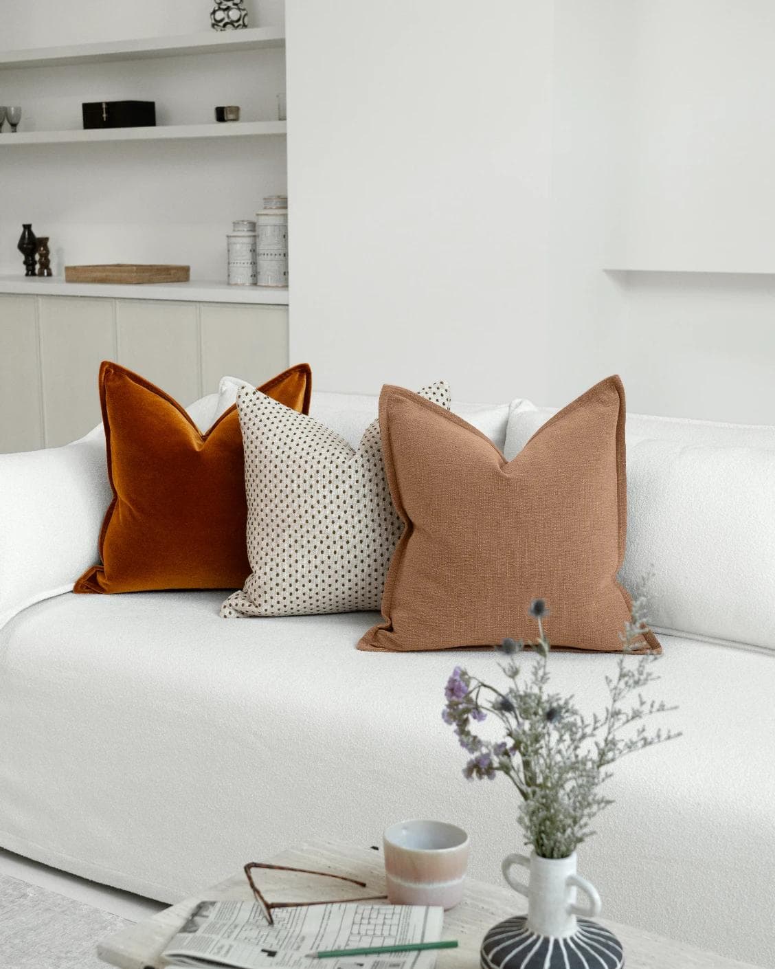 Azar Bundle cushion in beige and rust, shown in a lifestyle right view as image 2
