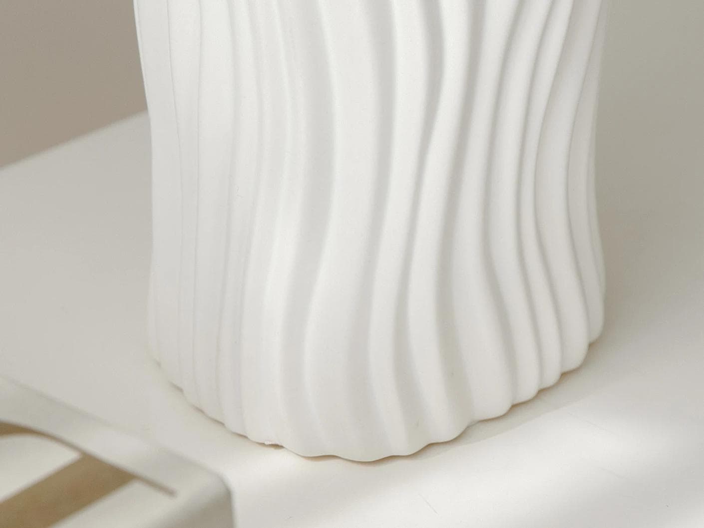Baiza Arneson vases in white, shown in a lifestyle left view as image 5