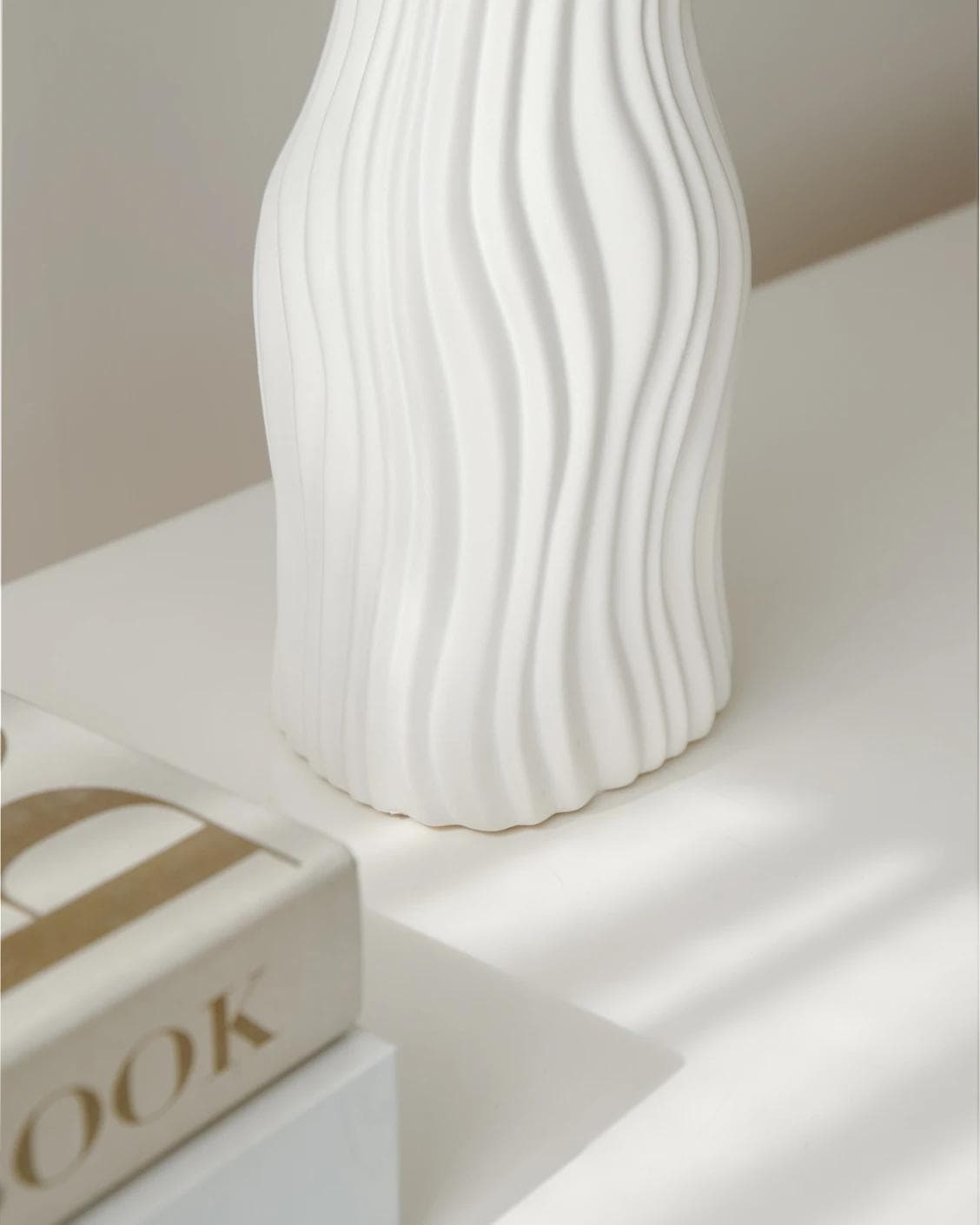 Baiza Arneson vases in white, shown in a lifestyle left view as image 5