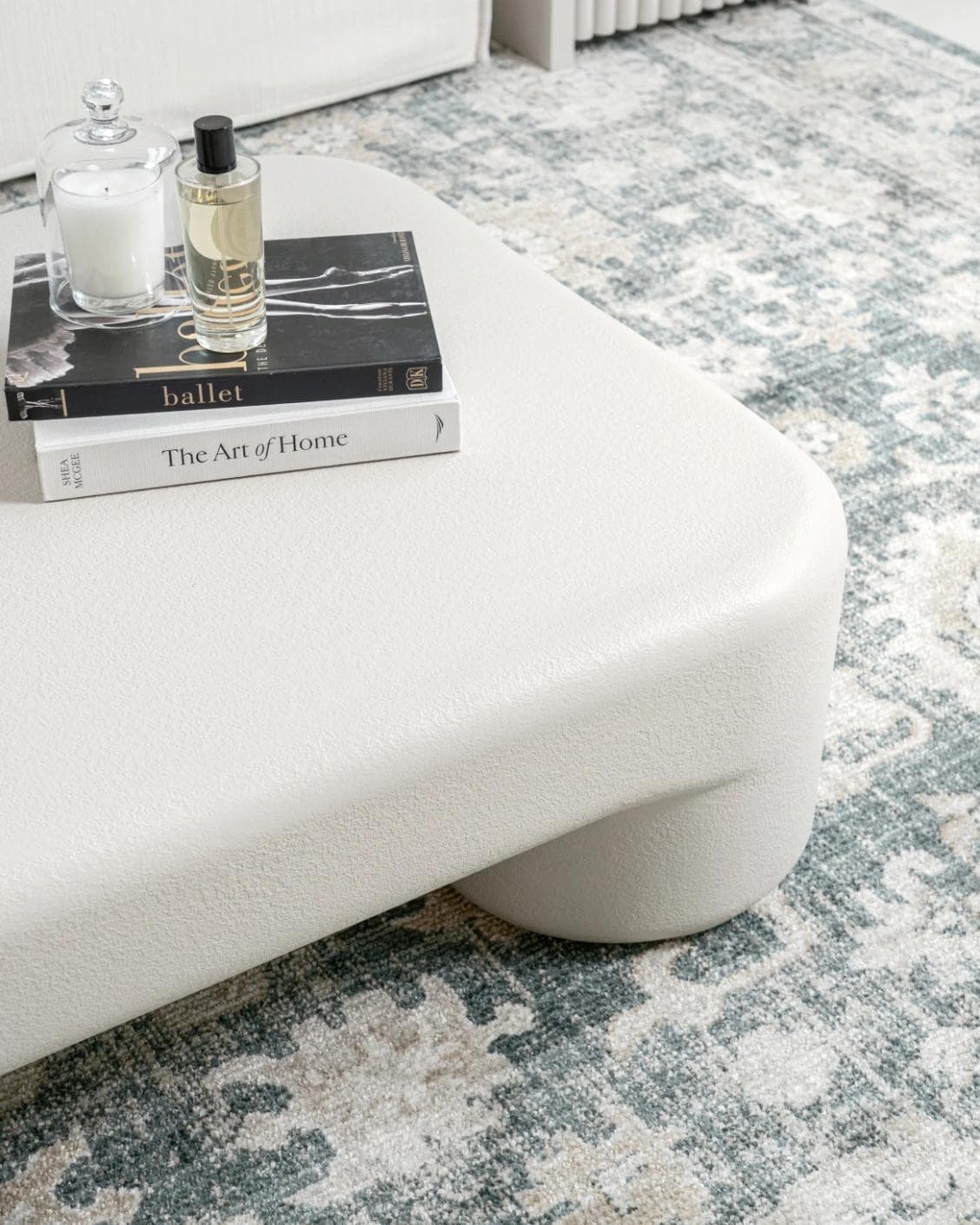 Bari coffee table in soft ivory and stone, shown in a lifestyle close-up as image 4