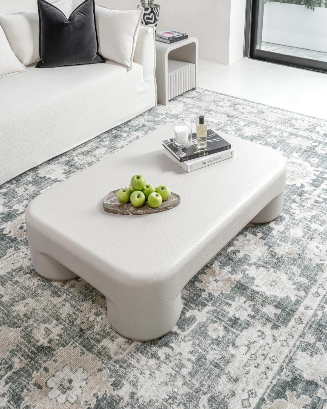 Bari coffee table in soft ivory and stone, shown in a lifestyle top view as image 6