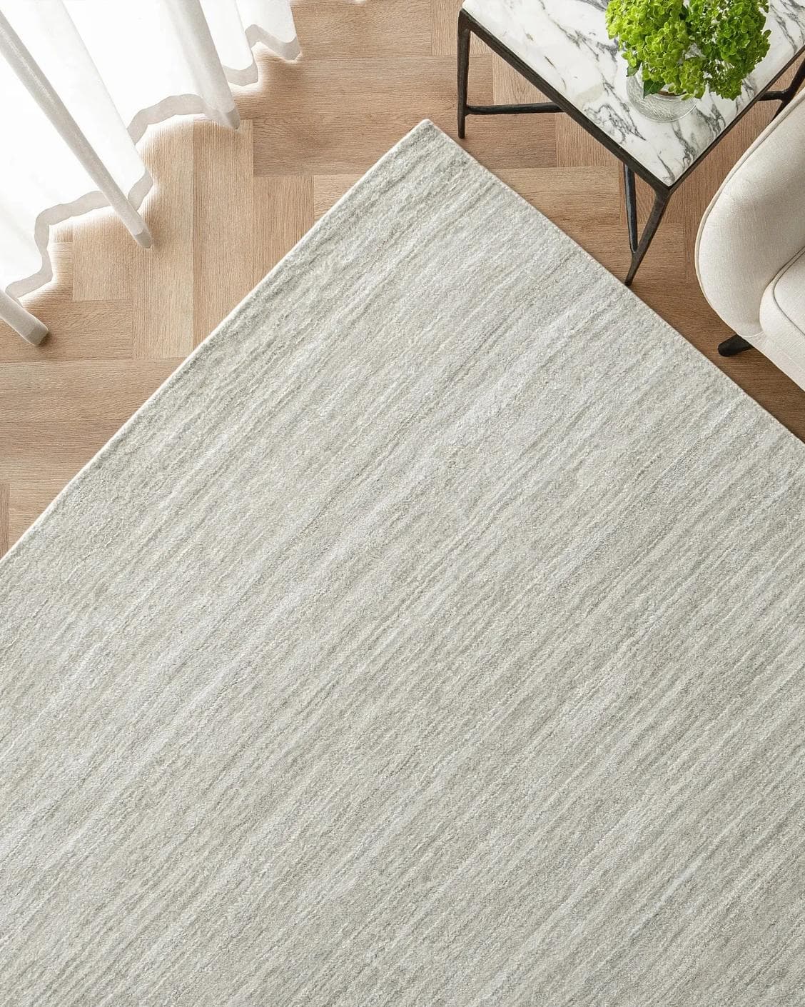 Beatrice Alba carpet in grey, shown in a lifestyle top view as image 2
