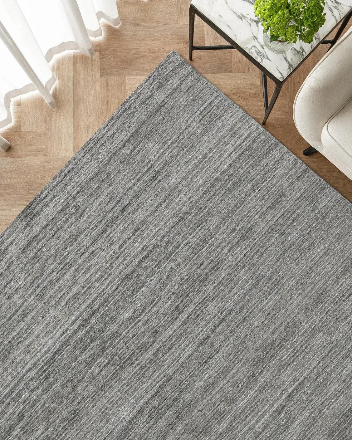 Beatrice Ashton carpet in grey, shown in a lifestyle top view as image 2