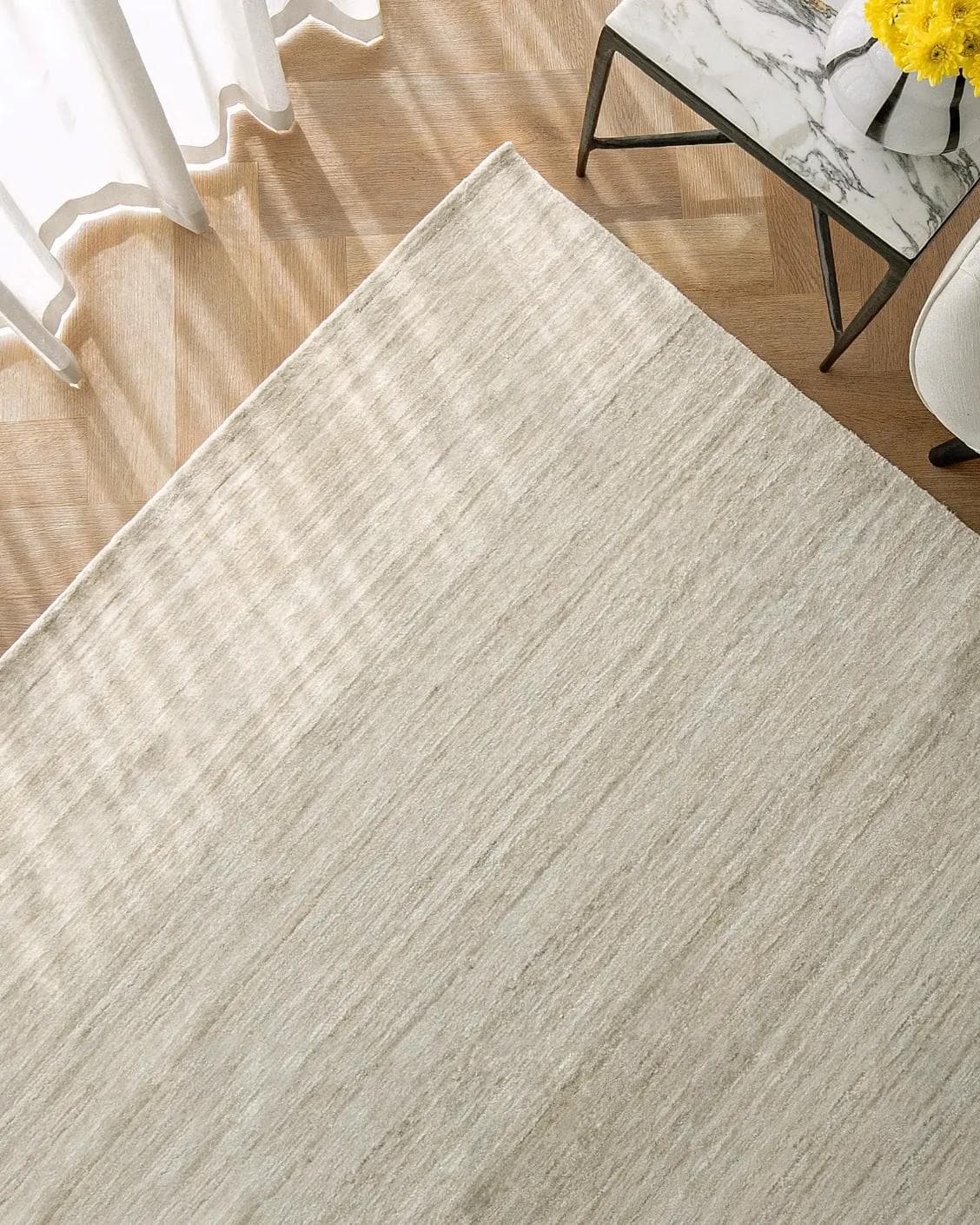 Beatrice Sandy 02 carpet in beige, shown in a lifestyle top view as image 2