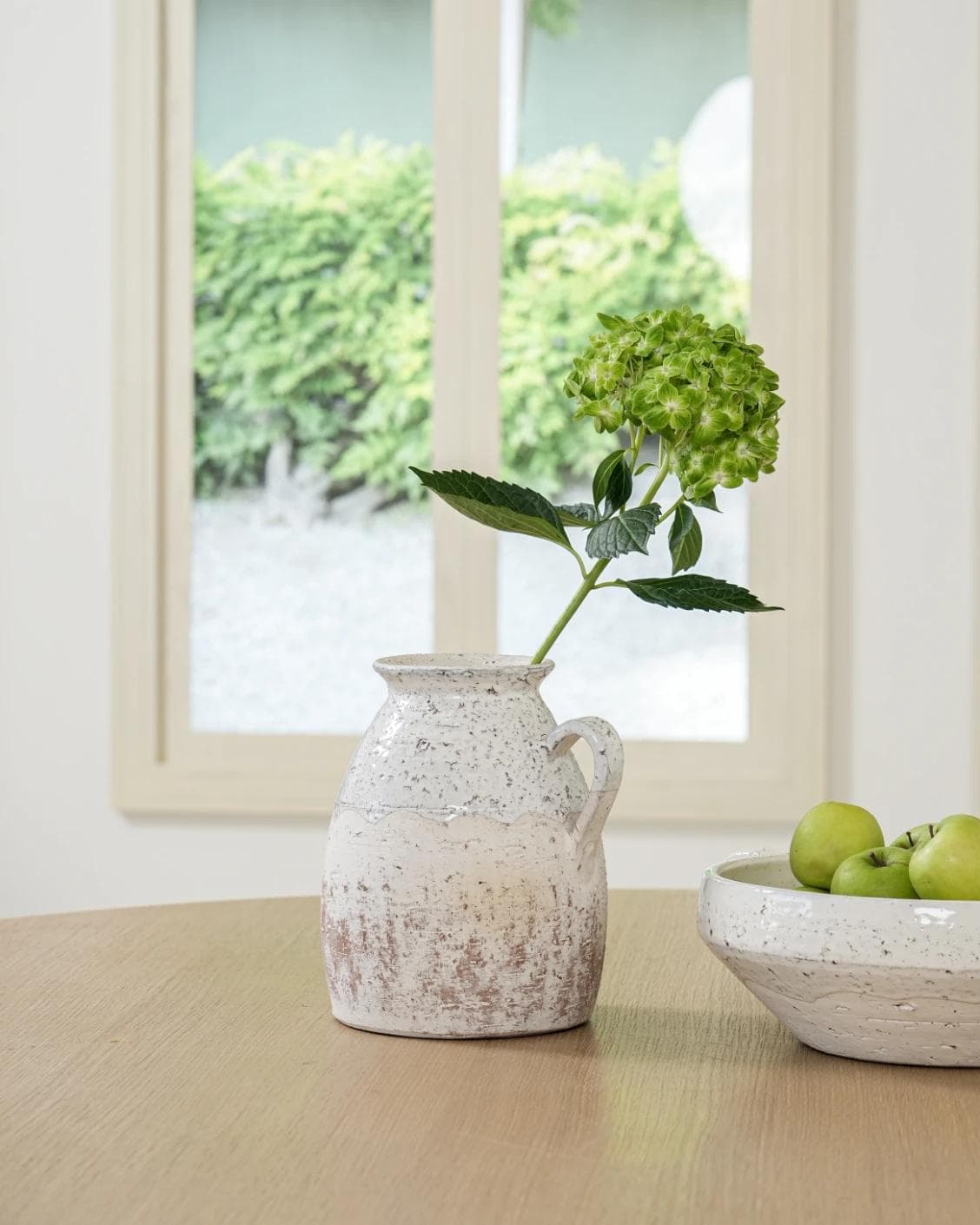 Becca Terra vases in soft stone and white, shown in a lifestyle front view as image 2