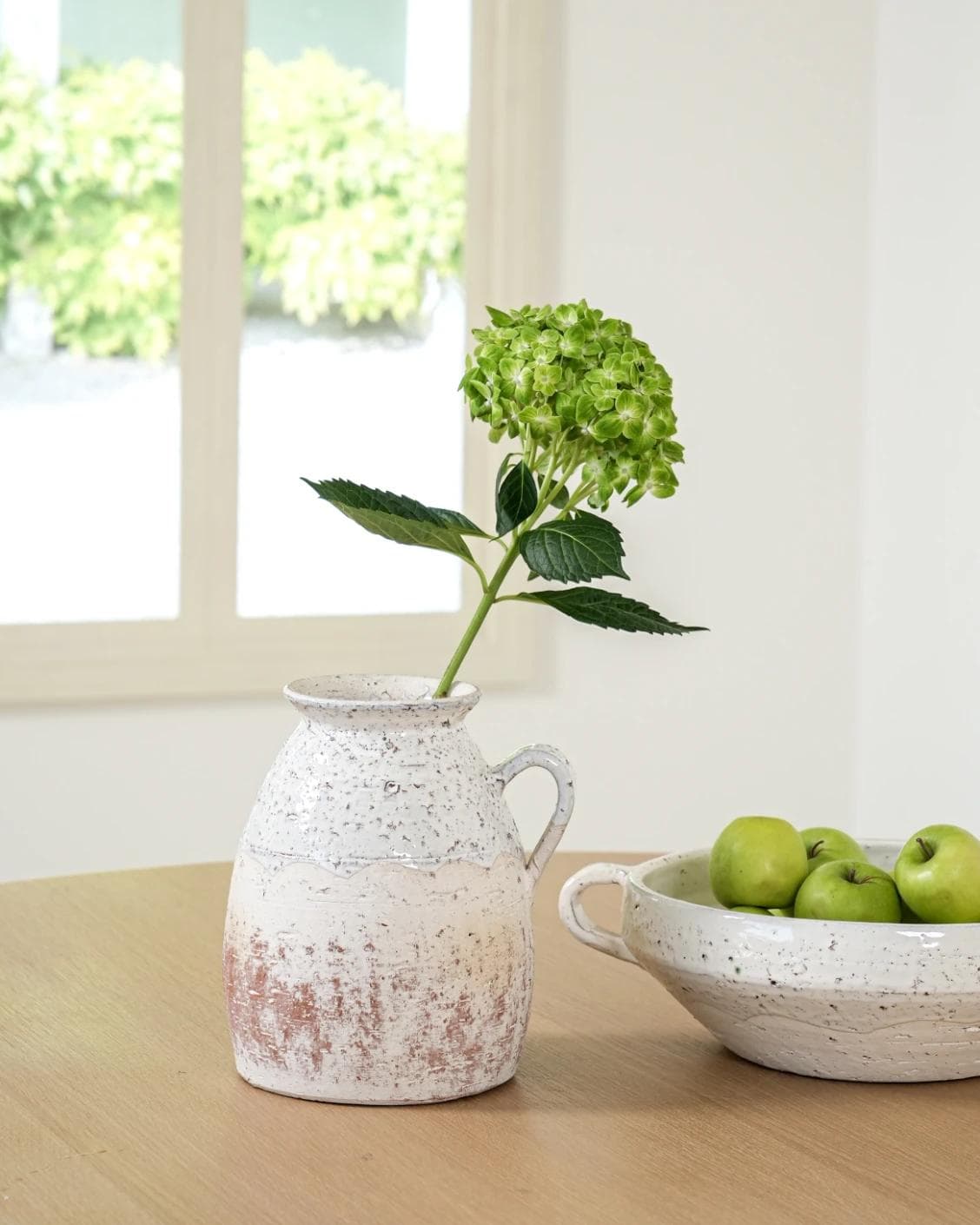 Becca Terra vases in soft stone and white, shown in a lifestyle front view as image 4